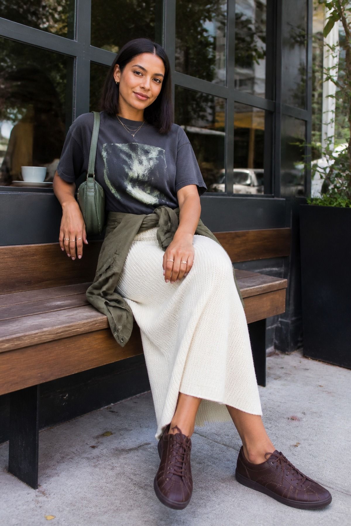 Woman wearing a graphic tee with a neutral maxi skirt, a casual t-shirt and skirt outfit