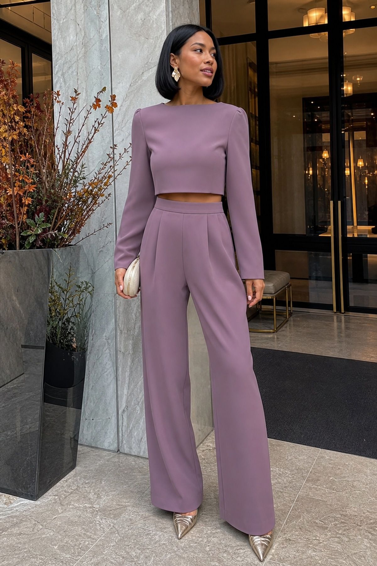Woman wearing a two-piece set in heavier crepe with wide-leg trousers, a fall wedding guest outfit