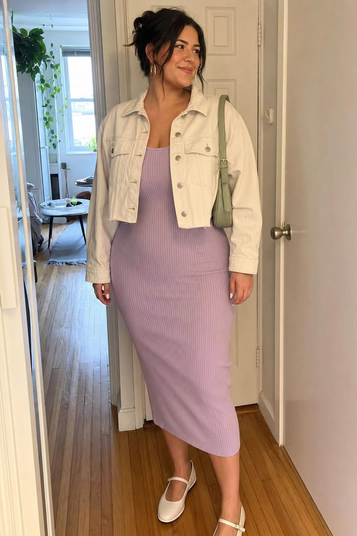 Woman wearing a ribbed midi dress with a cropped jacket, a spring date night outfit