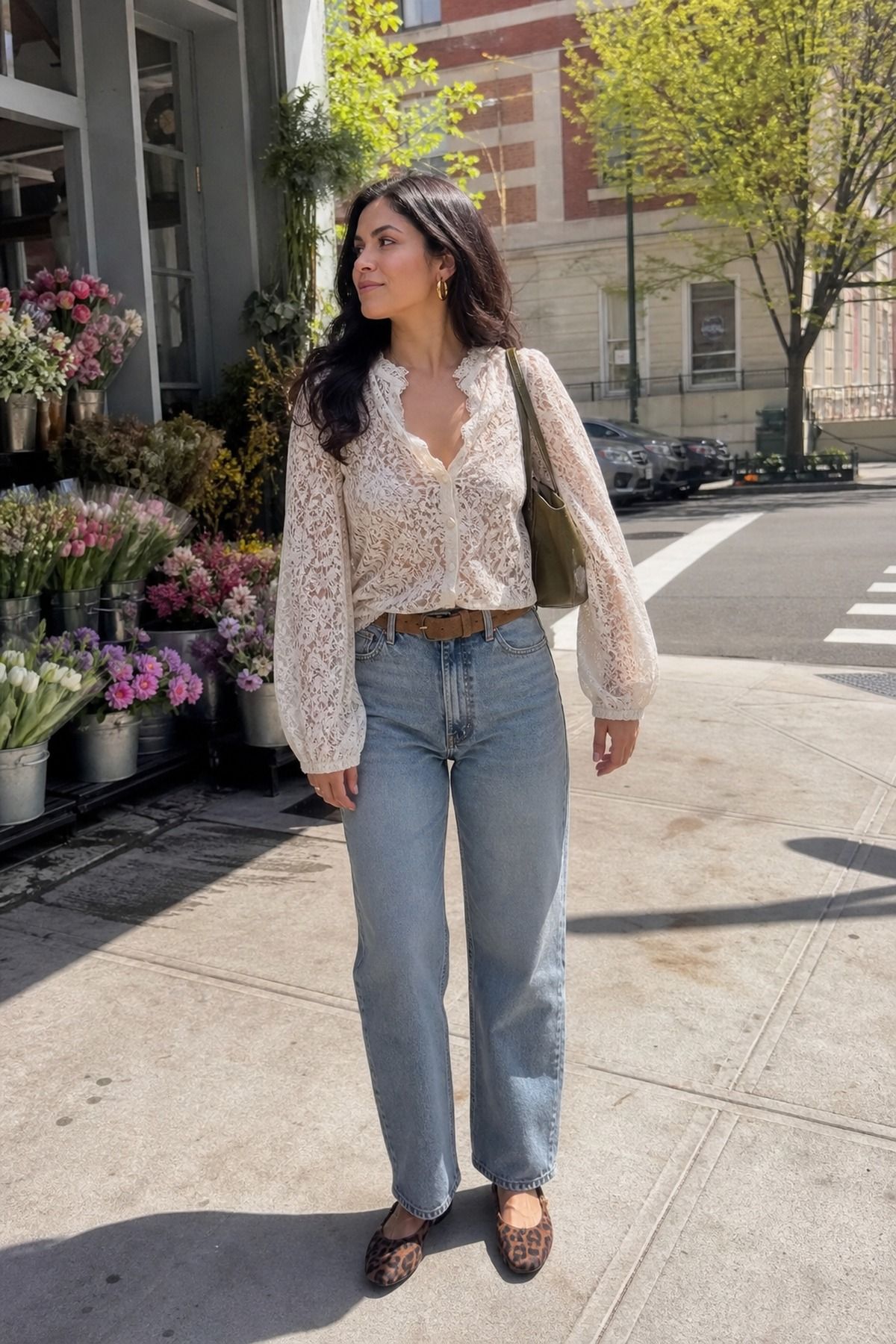 Woman wearing a lace blouse with vintage-wash jeans, a spring date night outfit