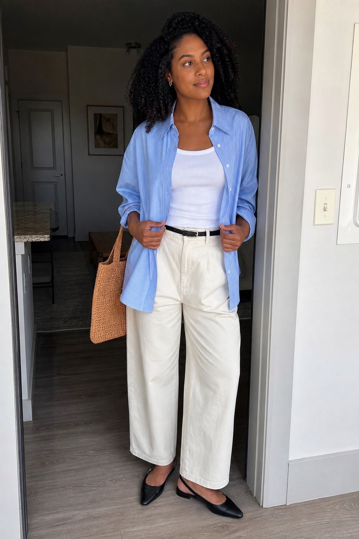 Woman wearing a button down over a tank