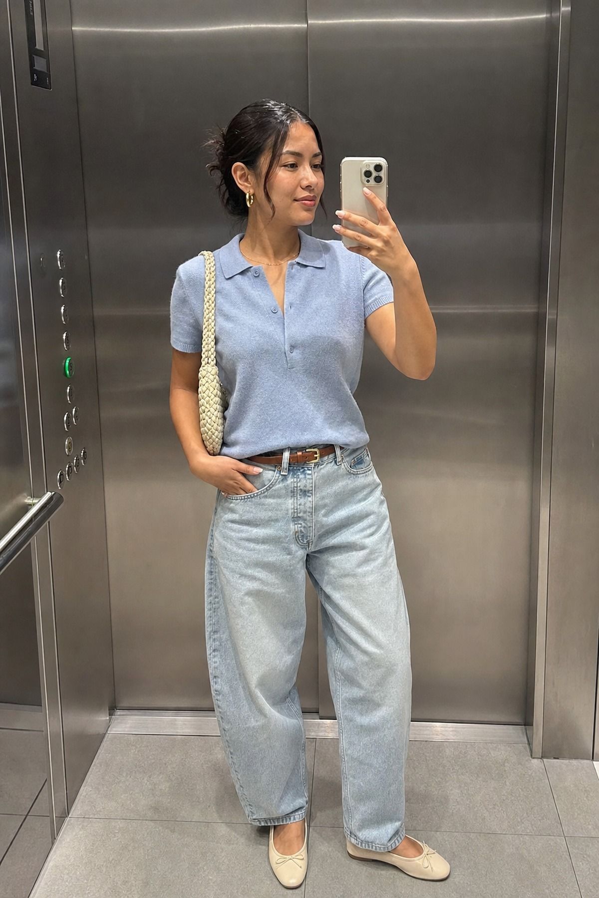 Woman wearing a polo knit and relaxed jeans