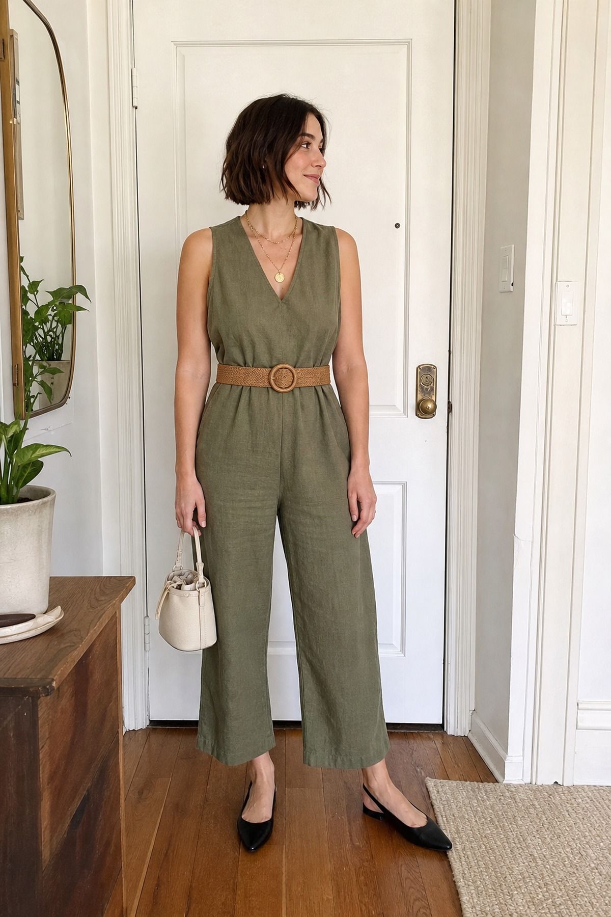 Woman wearing a jumpsuit with a belt