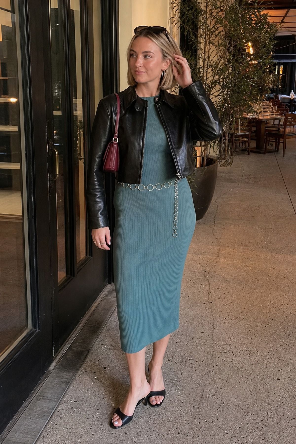 Woman wearing a ribbed midi dress with a leather jacket, a spring dinner outfit