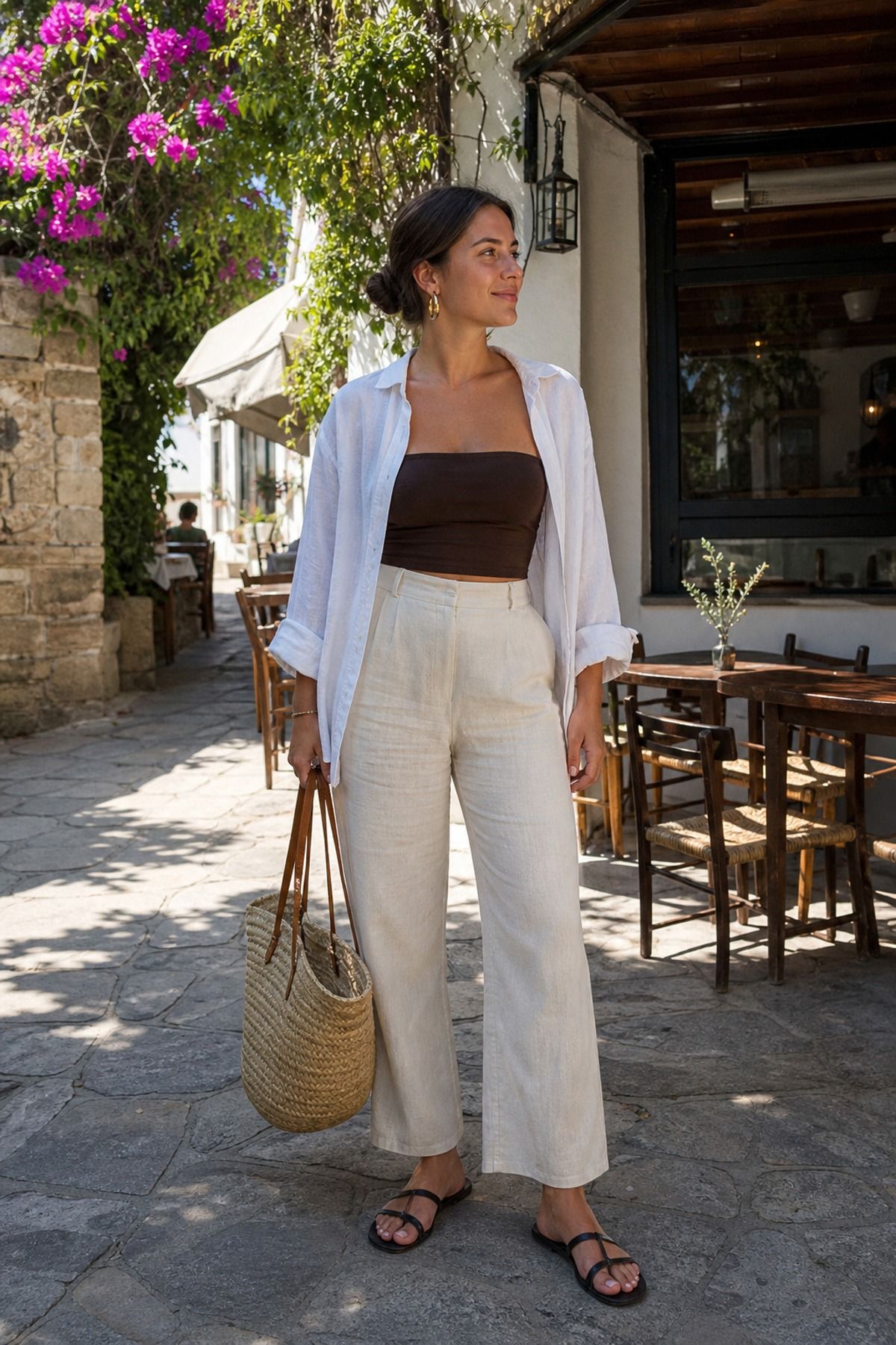 Woman wearing linen pants with a bandeau and shirt, a summer casual outfit