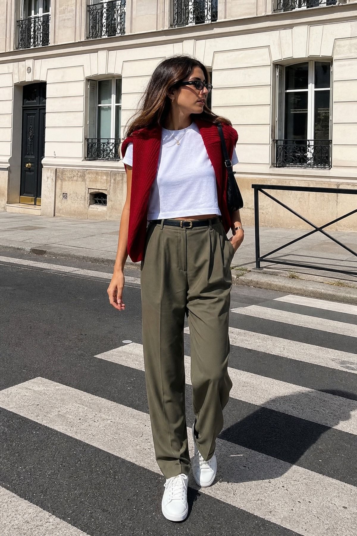 Woman wearing a white tee with relaxed trousers, a summer casual outfit