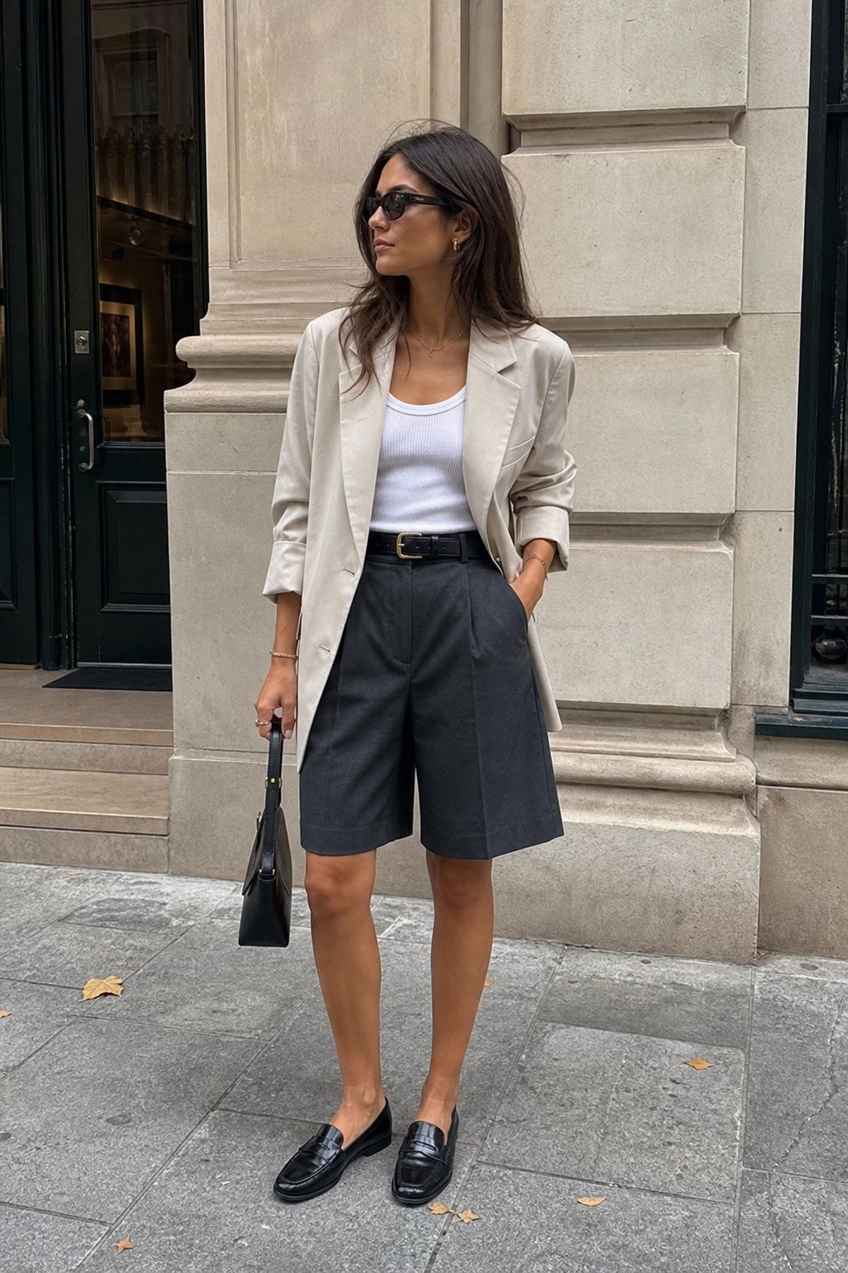 Woman wearing long shorts with a blazer, a summer shorts outfit
