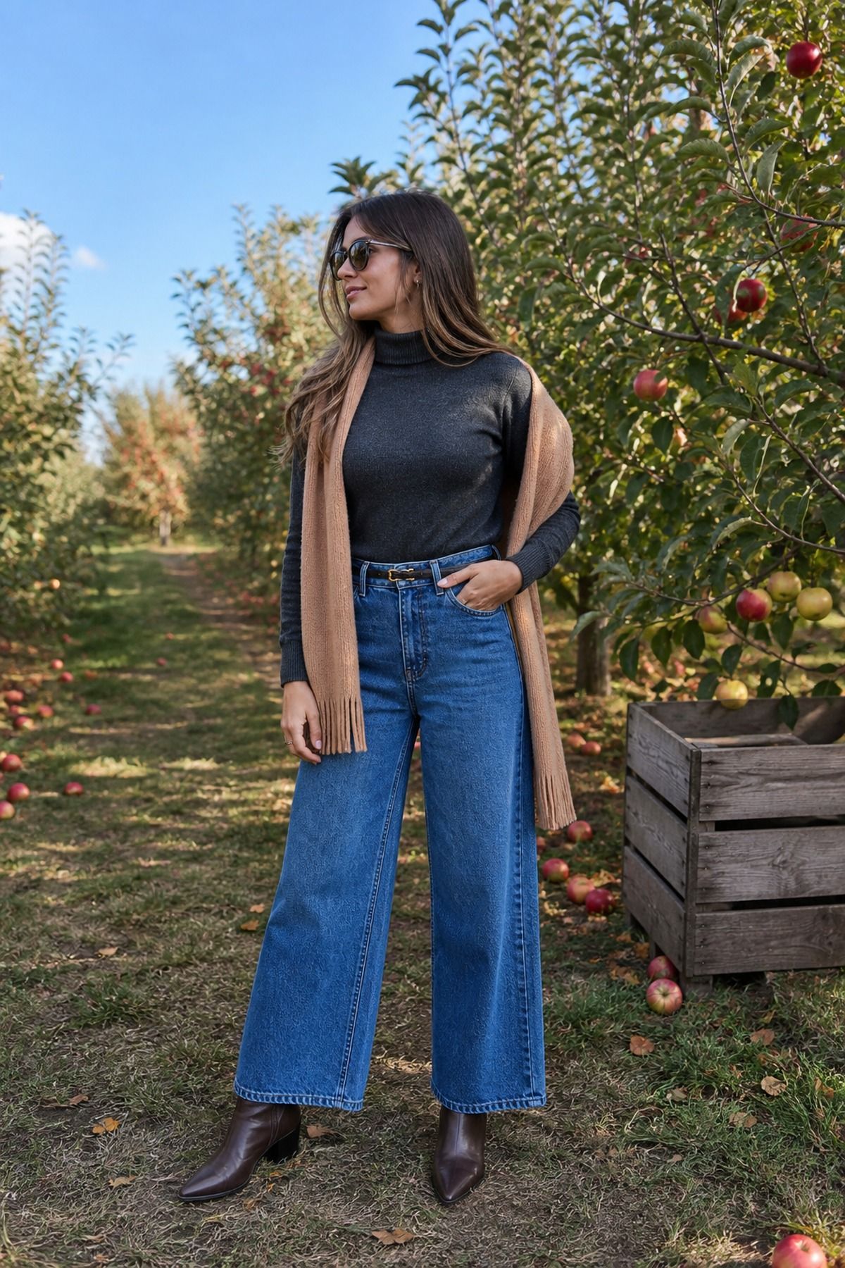 Woman wearing a turtleneck with wide-leg jeans, a fall apple picking outfit