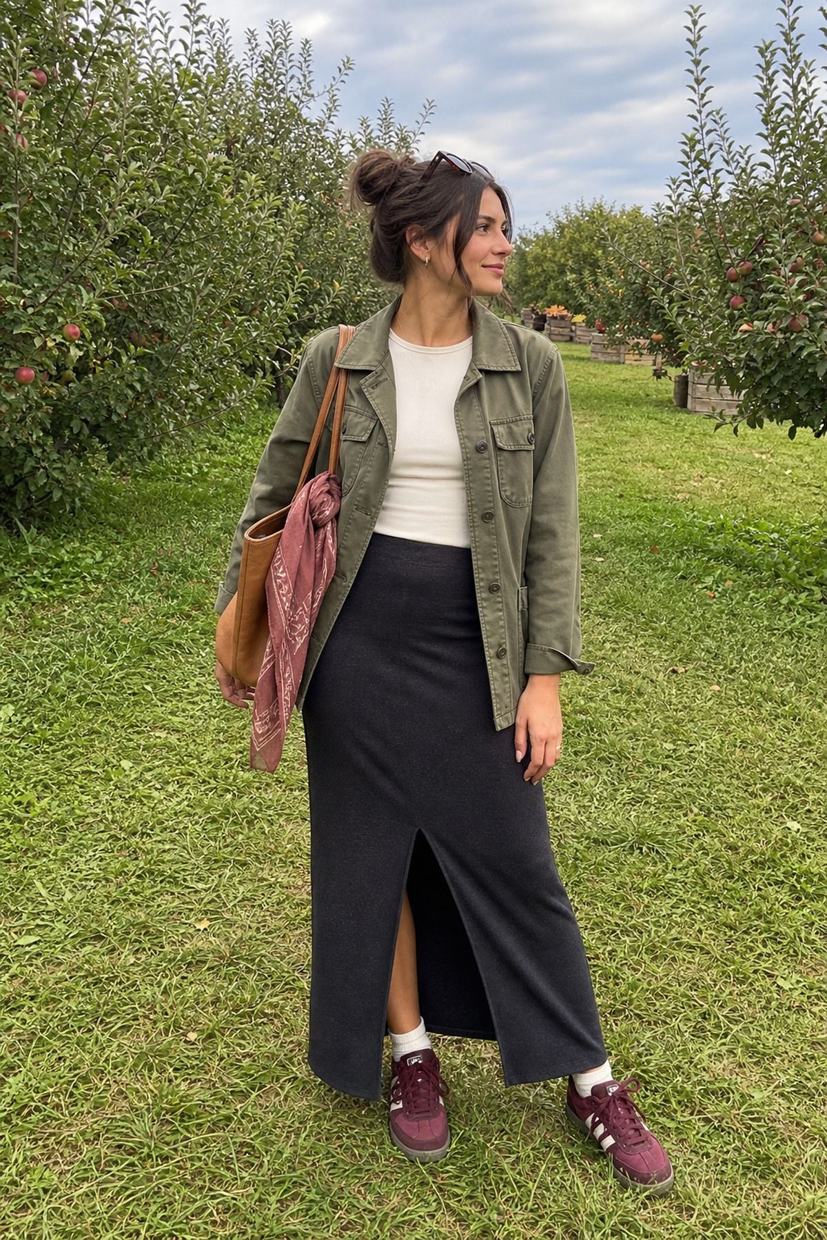 Woman wearing an utility jacket with a maxi skirt, a fall apple picking outfit