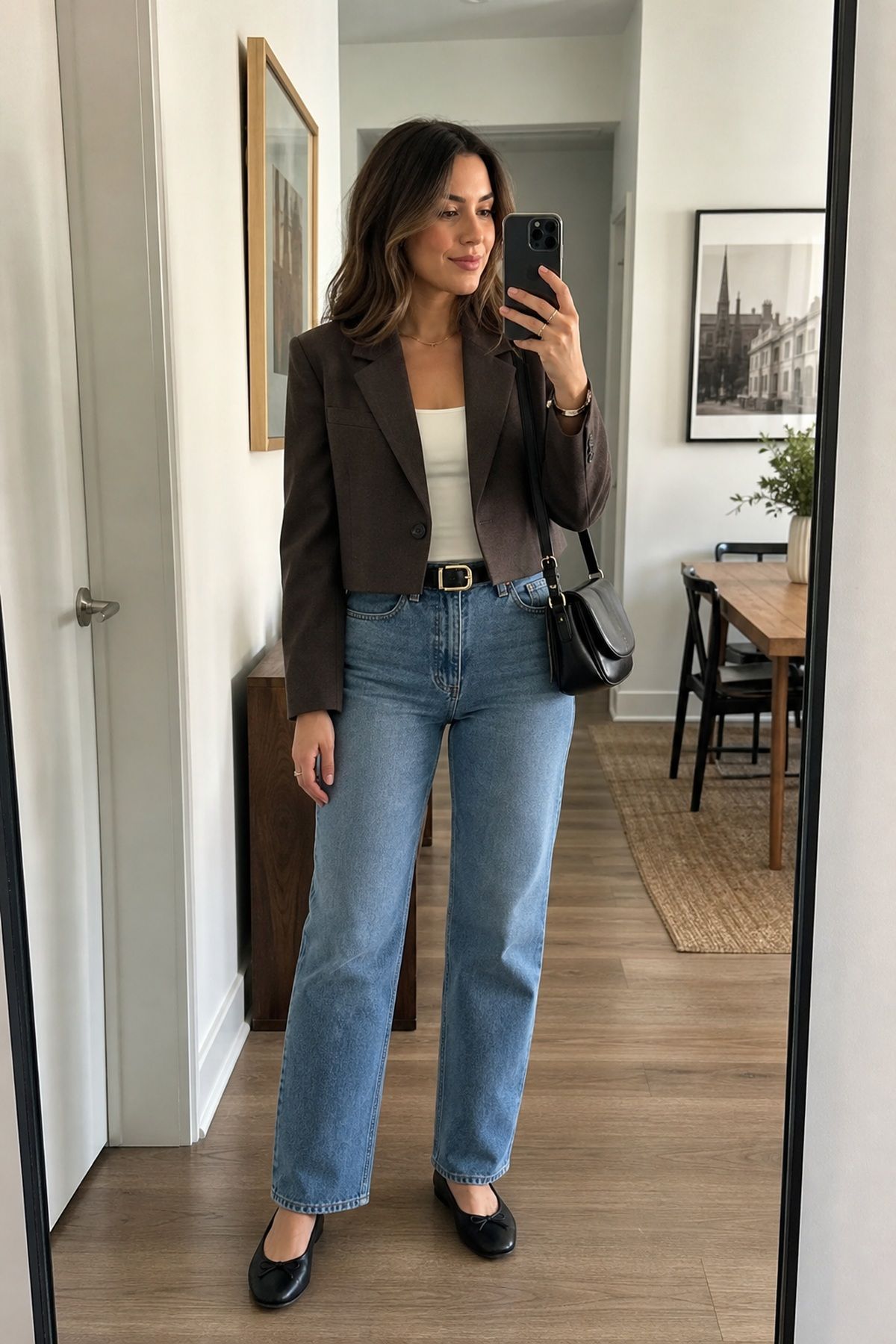 Woman wearing a cropped blazer with high-rise jeans, a fall blazer outfit