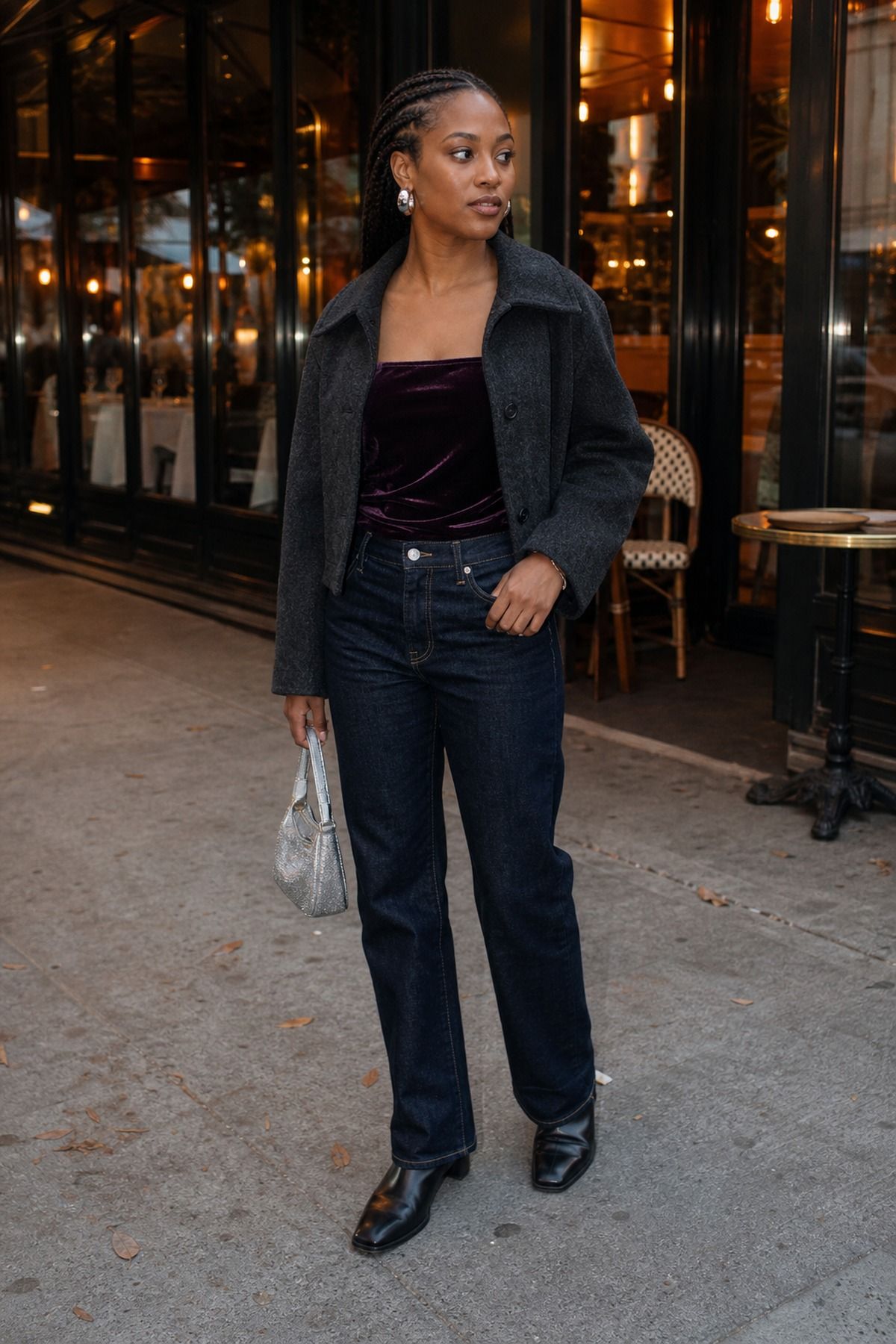Woman wearing a velvet top with straight denim, a fall dinner outfit