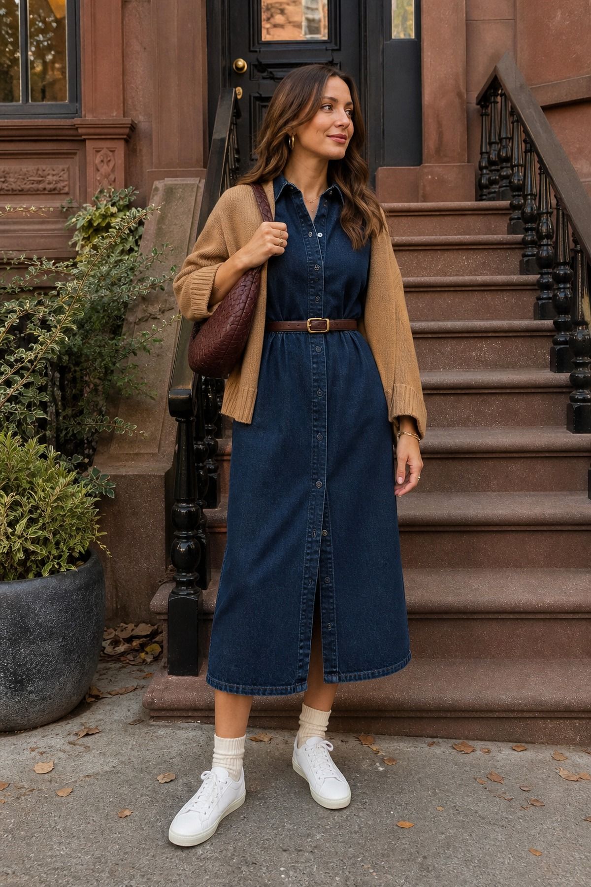 Woman wearing sneakers with a denim dress, a fall sneakers outfit