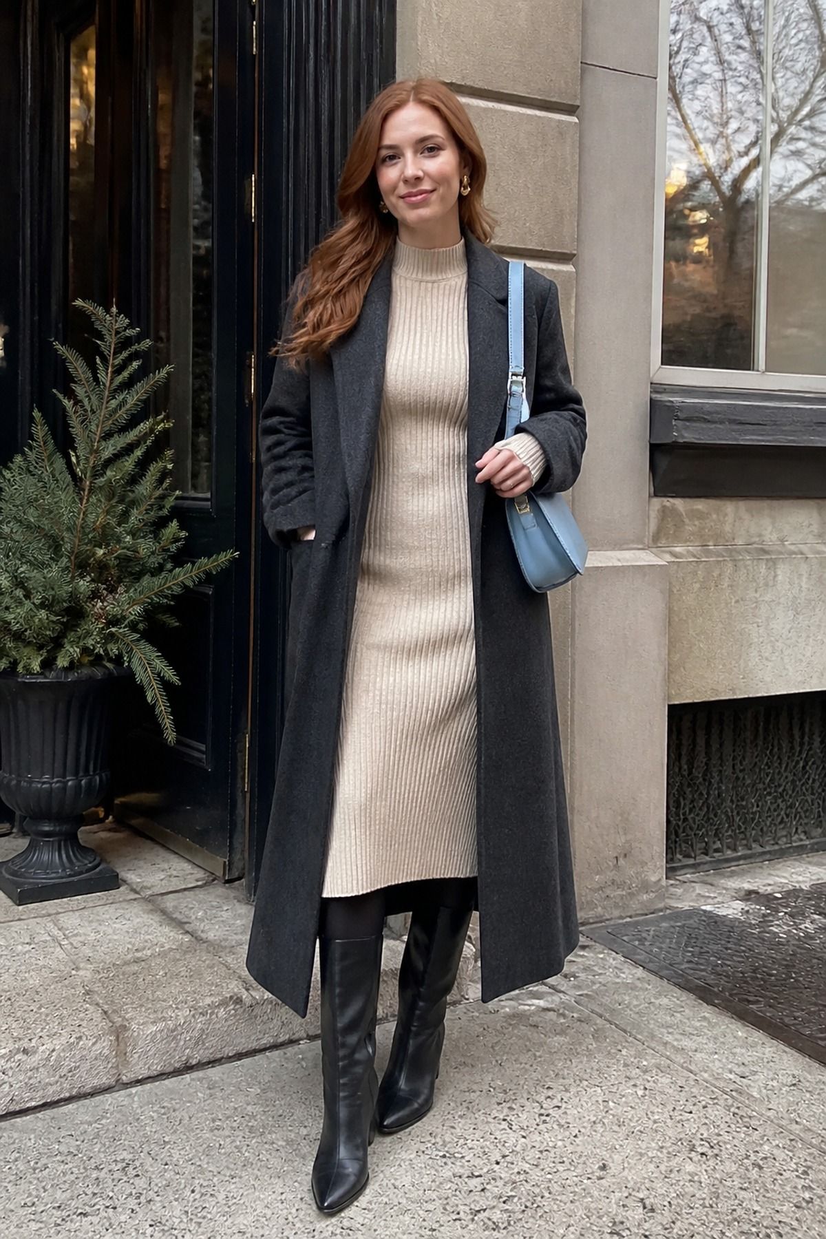 Woman wearing a knit midi dress with tall boots, a winter brunch outfit