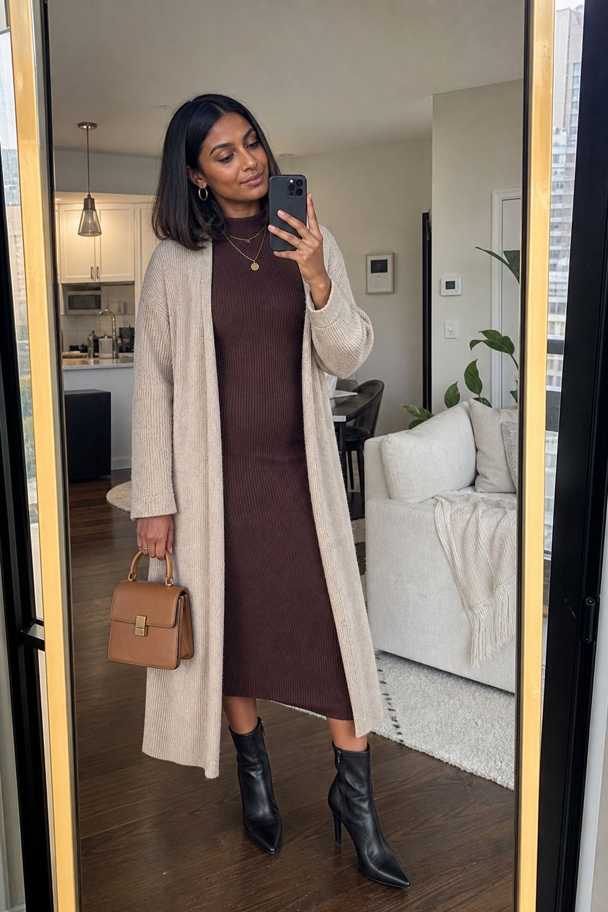 Woman wearing a ribbed dress with a long cardigan, a winter brunch outfit