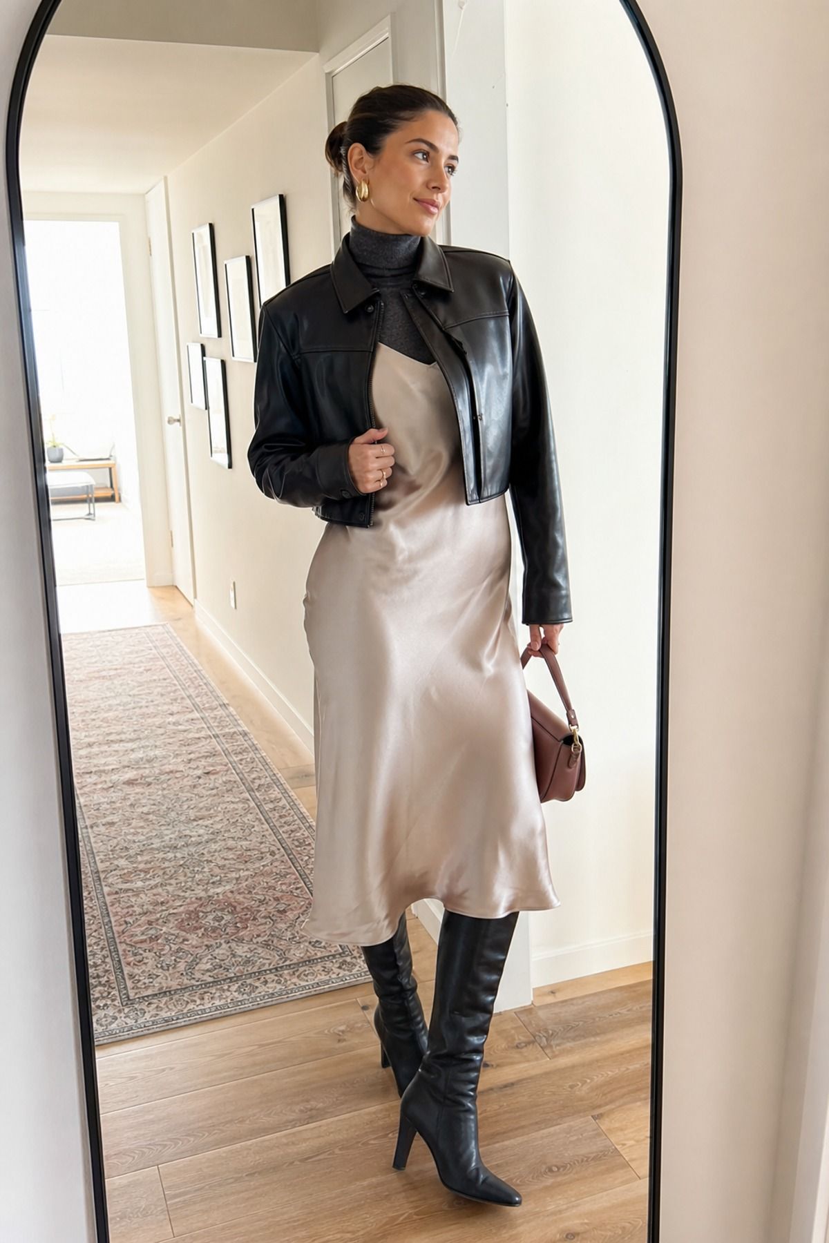 Woman wearing a slip dress with a turtleneck, a winter date night outfit