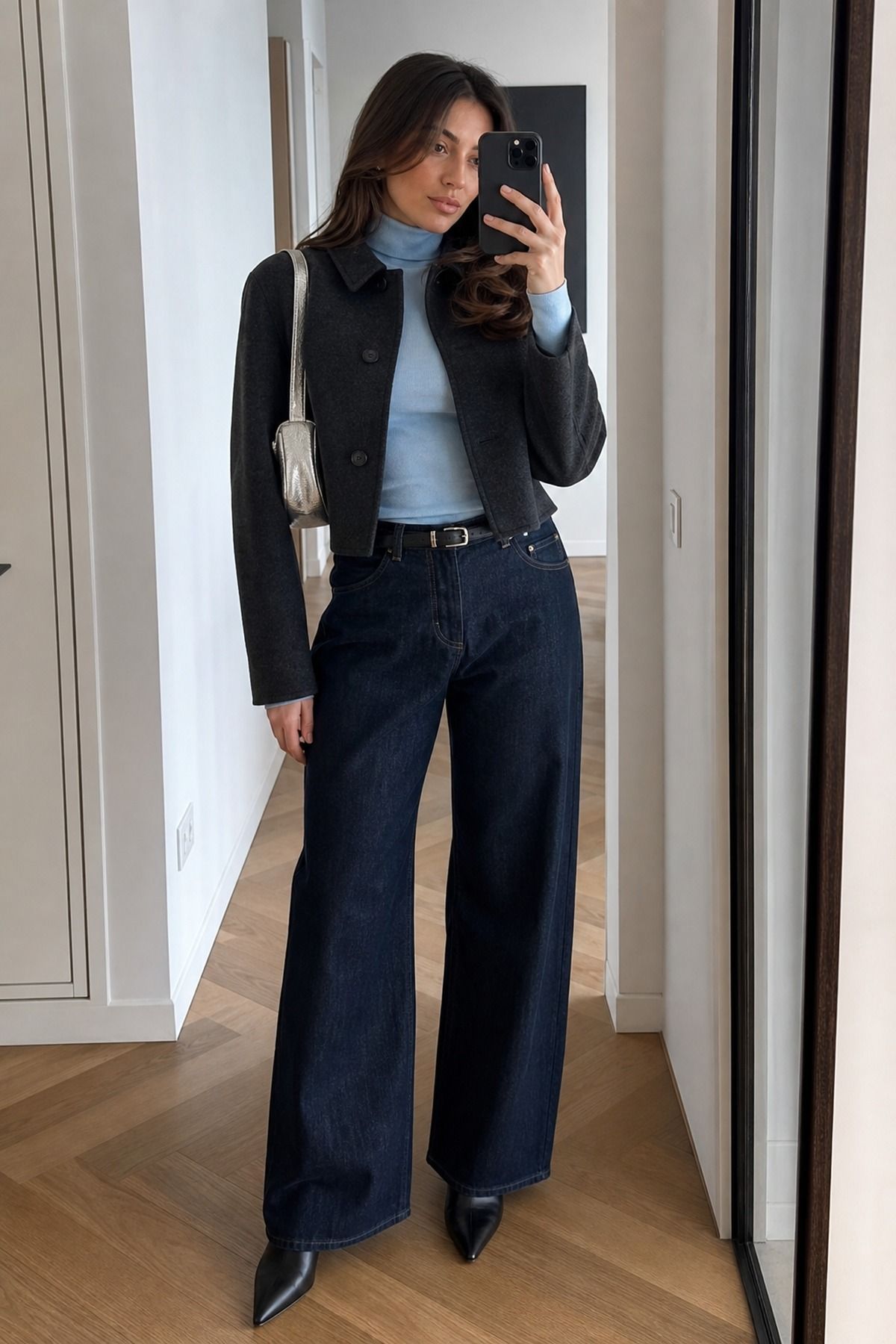 Woman wearing wide-leg jeans with a fitted turtleneck, a winter jeans outfit