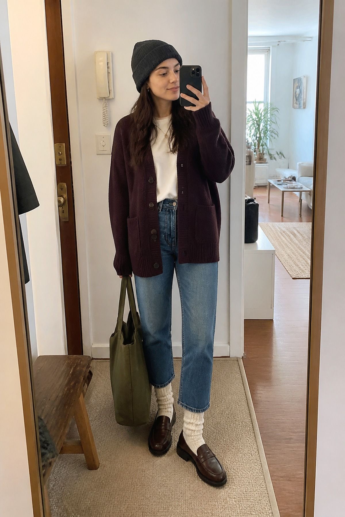 Woman wearing cropped jeans with cozy socks, a winter jeans outfit
