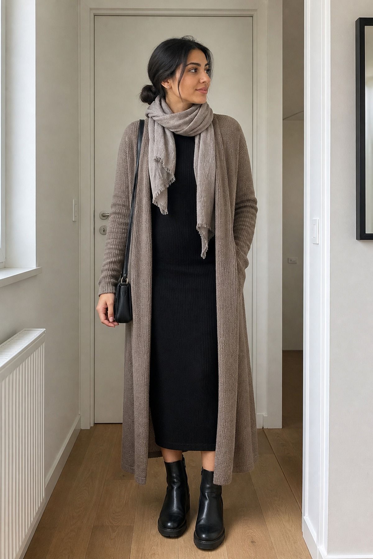 Woman wearing a long cardigan with a column dress, a 50 degree weather outfit