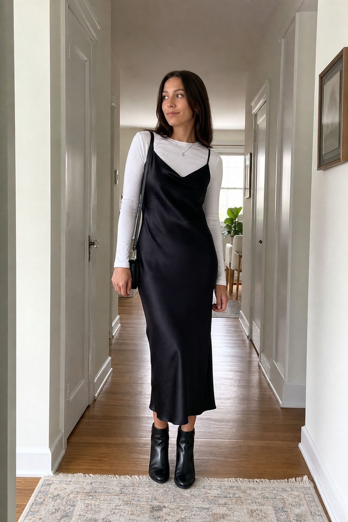 Woman wearing a long sleeve tee with a slip dress, a 60 degree weather outfit