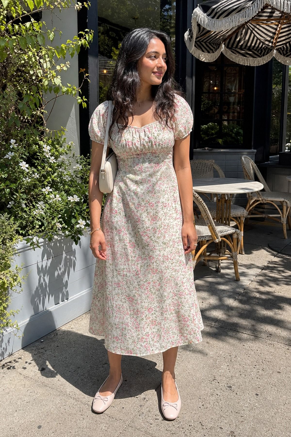 Woman wearing a floral midi dress with ballet flats, a brunch outfit