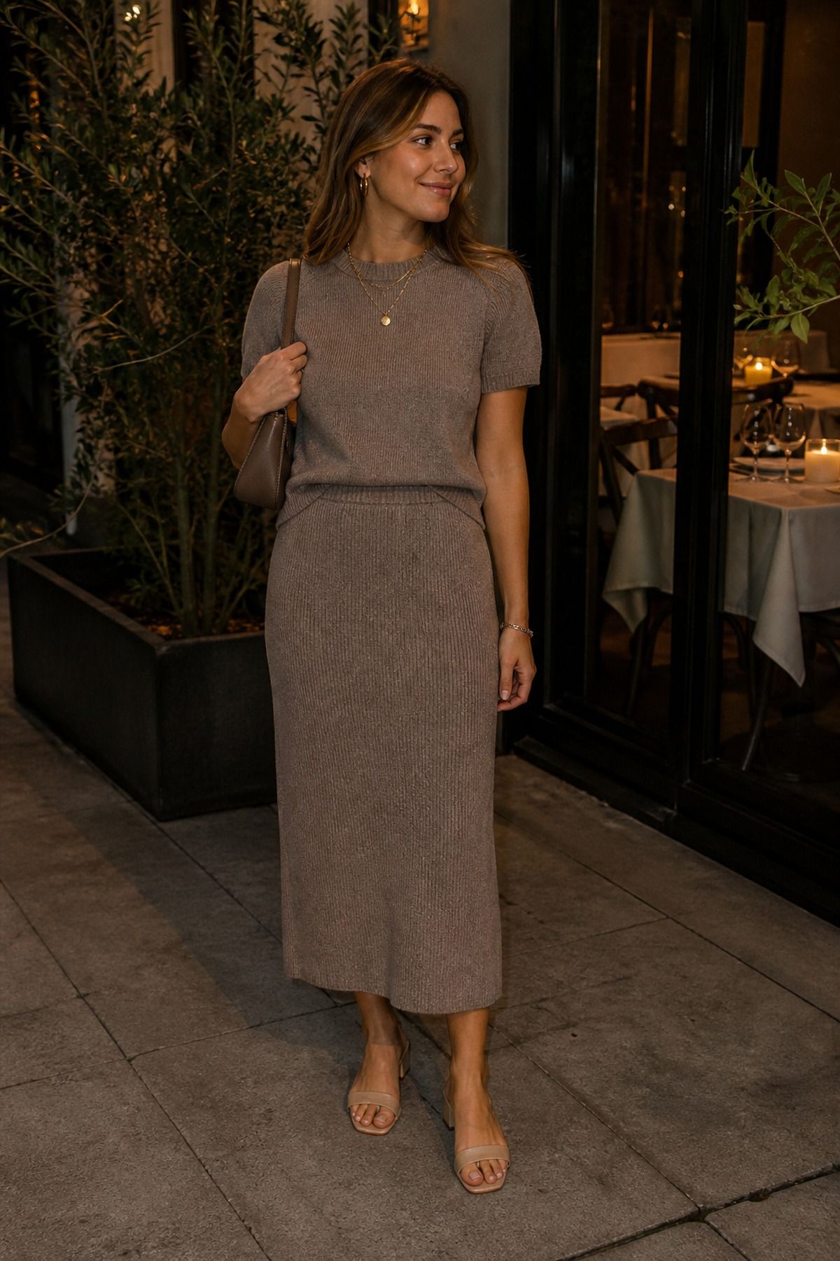 Woman wearing a monochrome knit set with jewelry, a casual date night outfit
