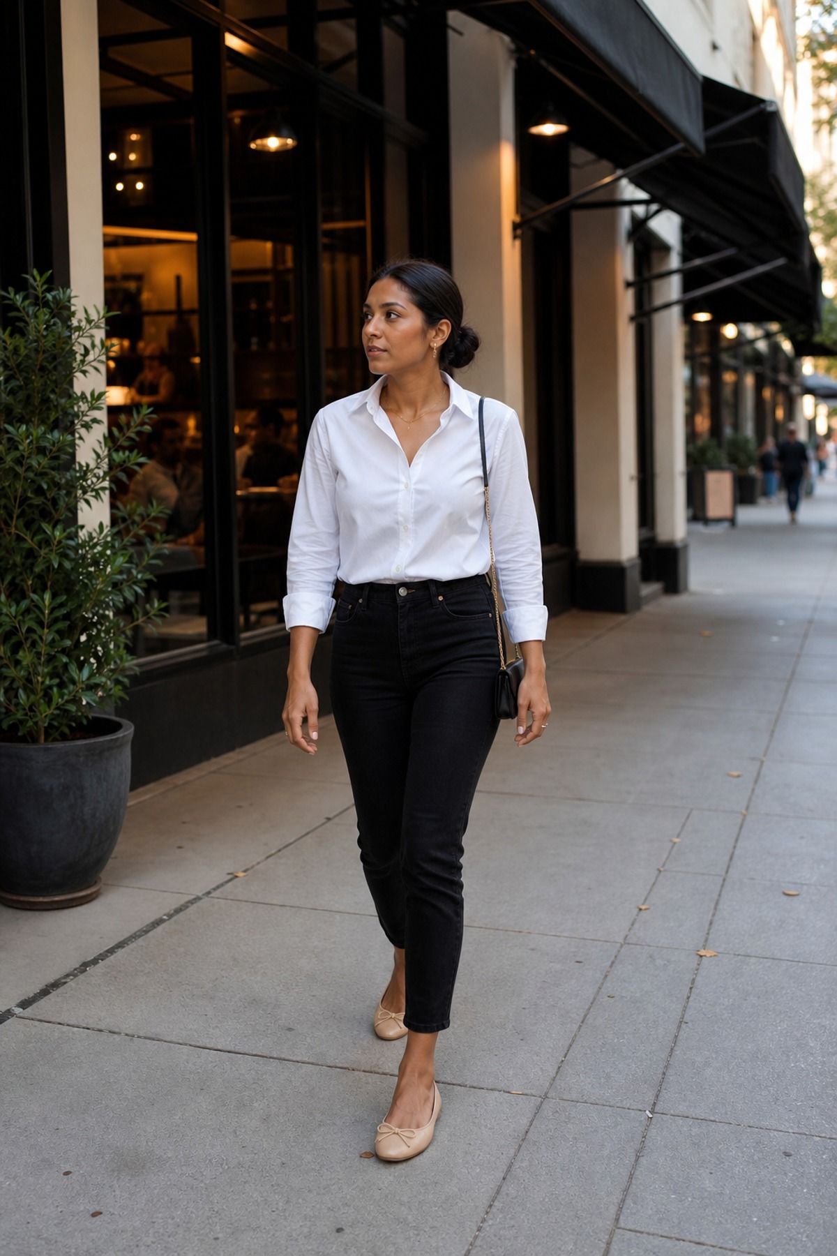 Woman wearing a white blouse with black jeans casual dinner