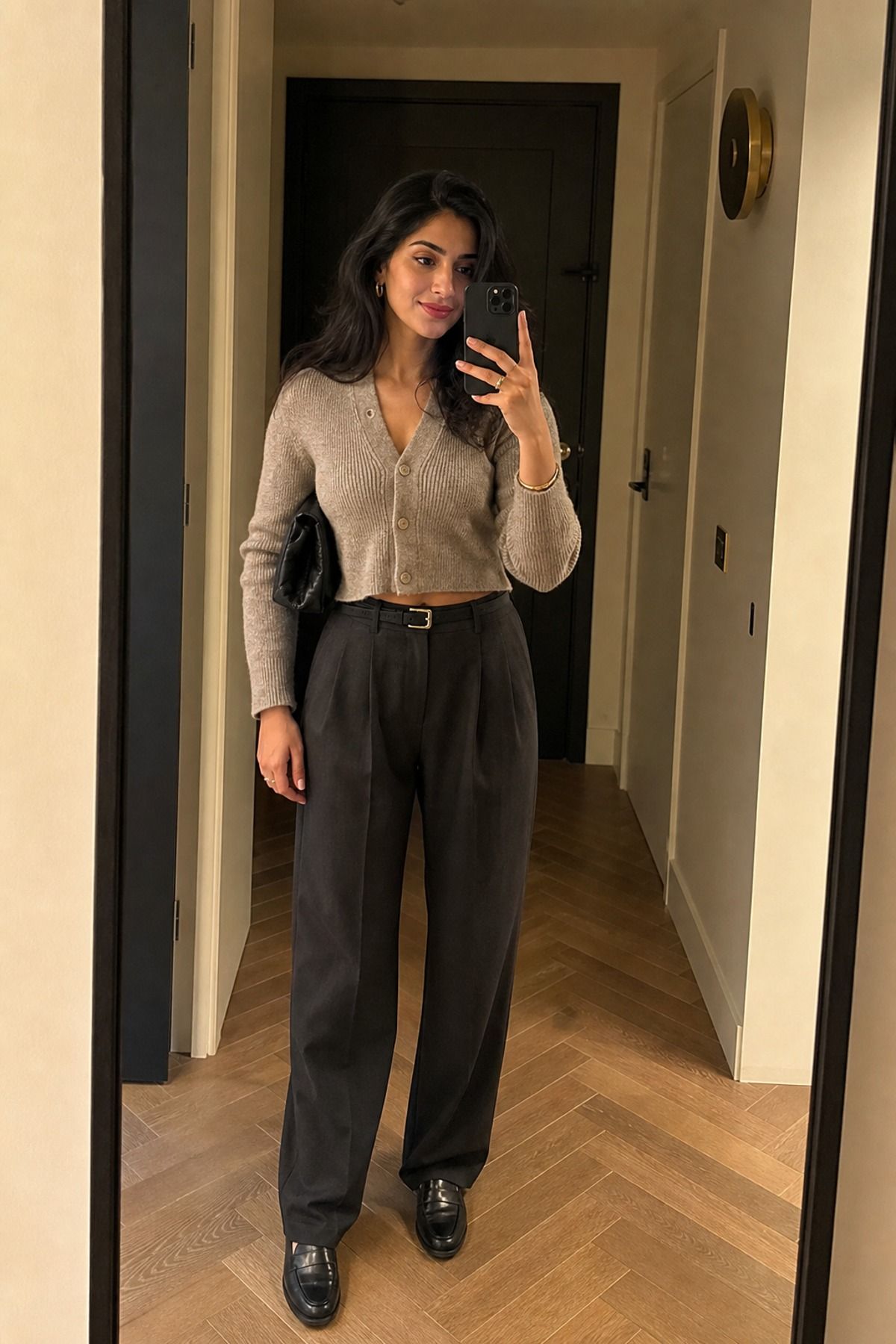 Woman wearing a cropped cardigan with trousers casual dinner