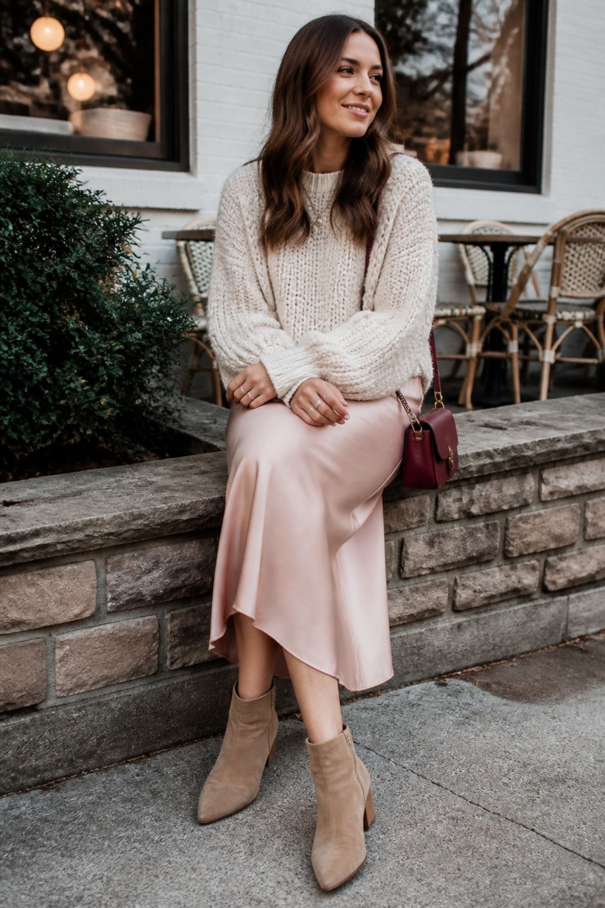 Woman wearing a slip skirt with a cozy knit, a casual Valentine outfit