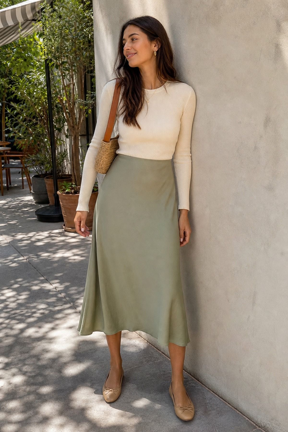 Woman wearing a midi skirt with a fitted sweater, a coffee date outfit