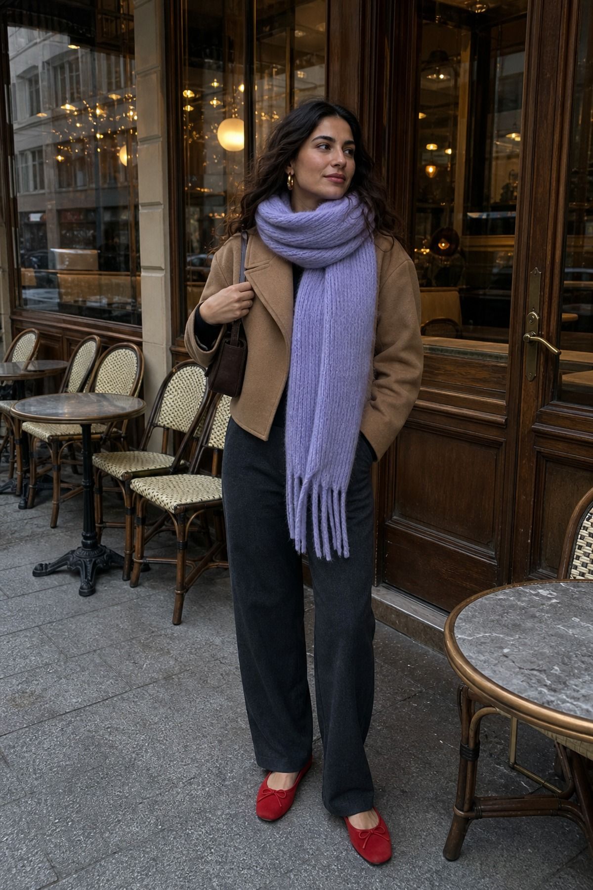 Woman wearing a chunky scarf with a simple base, a cozy winter outfit