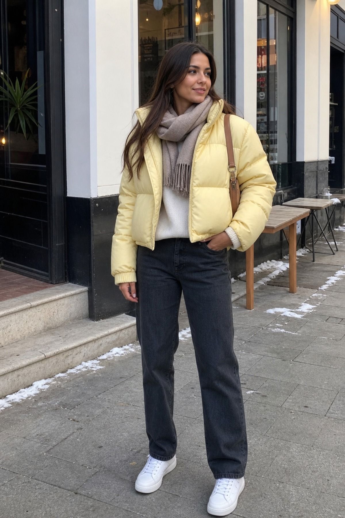 Woman wearing a colorful puffer with neutral basics, a puffer jacket outfit