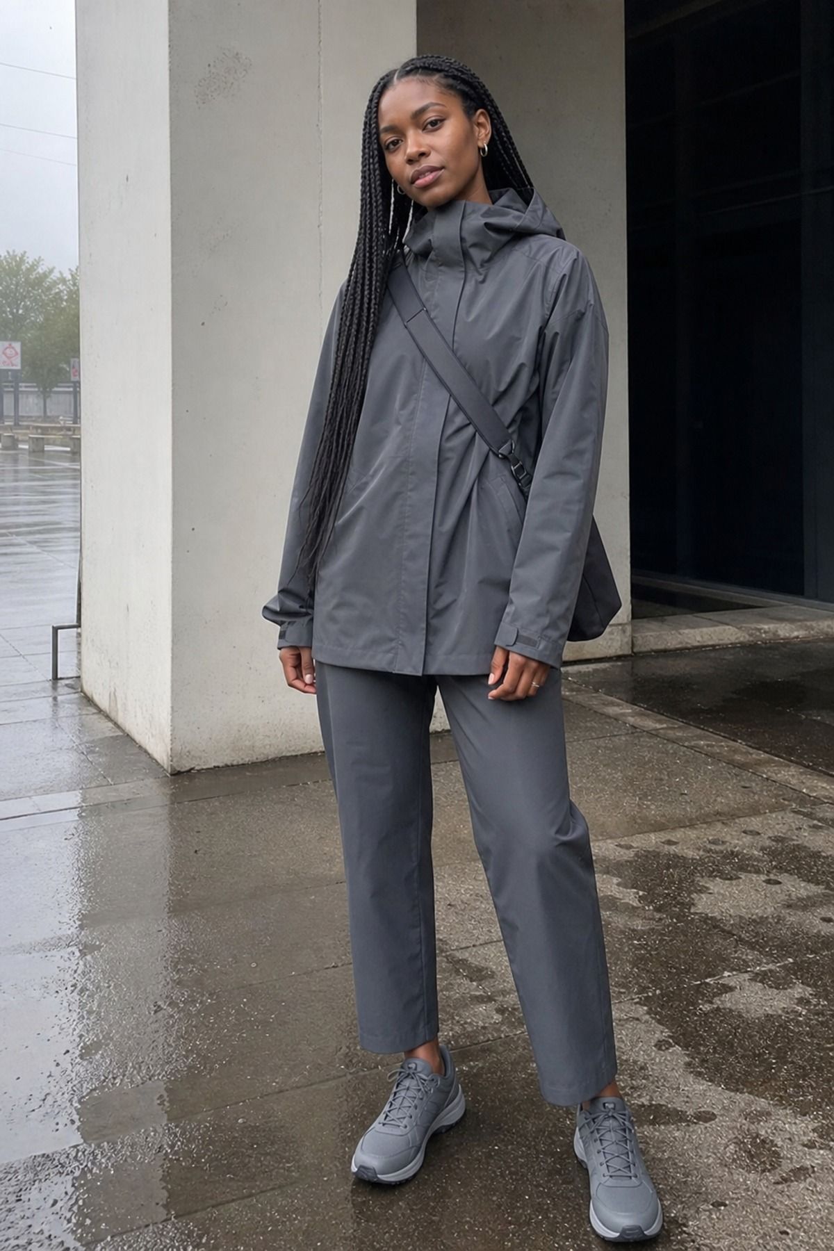 Woman wearing a monochrome rain outfit, a rainy day outfit