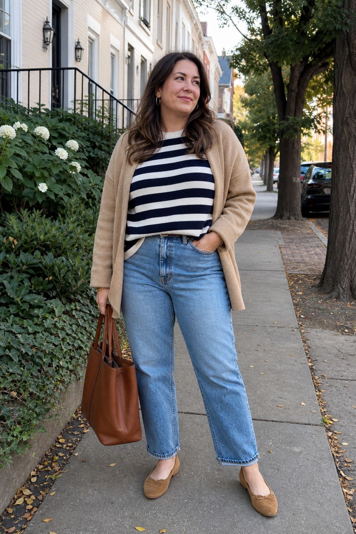 Woman wearing mom jeans with a striped sweater, a school drop off outfit
