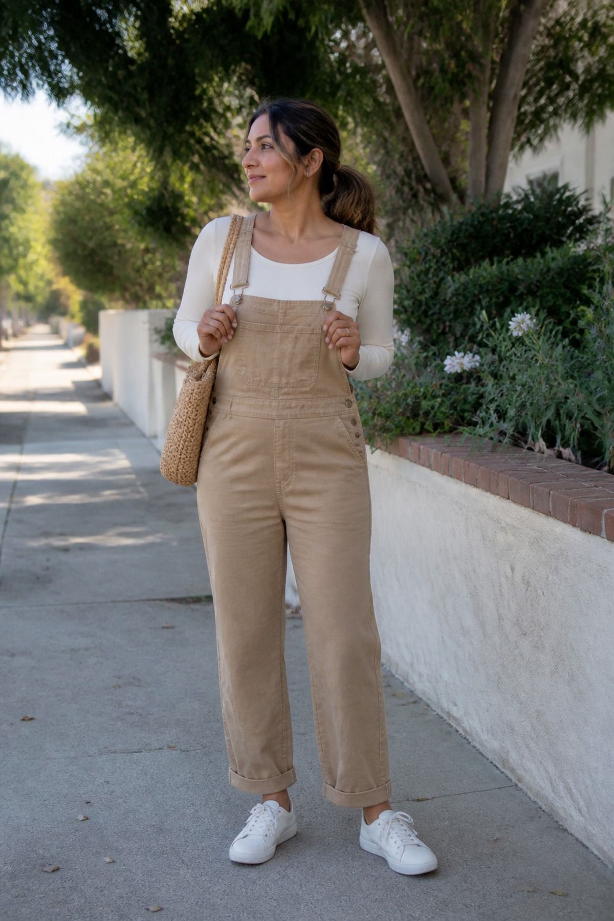Woman wearing soft overalls with a long sleeve tee, a school drop off outfit