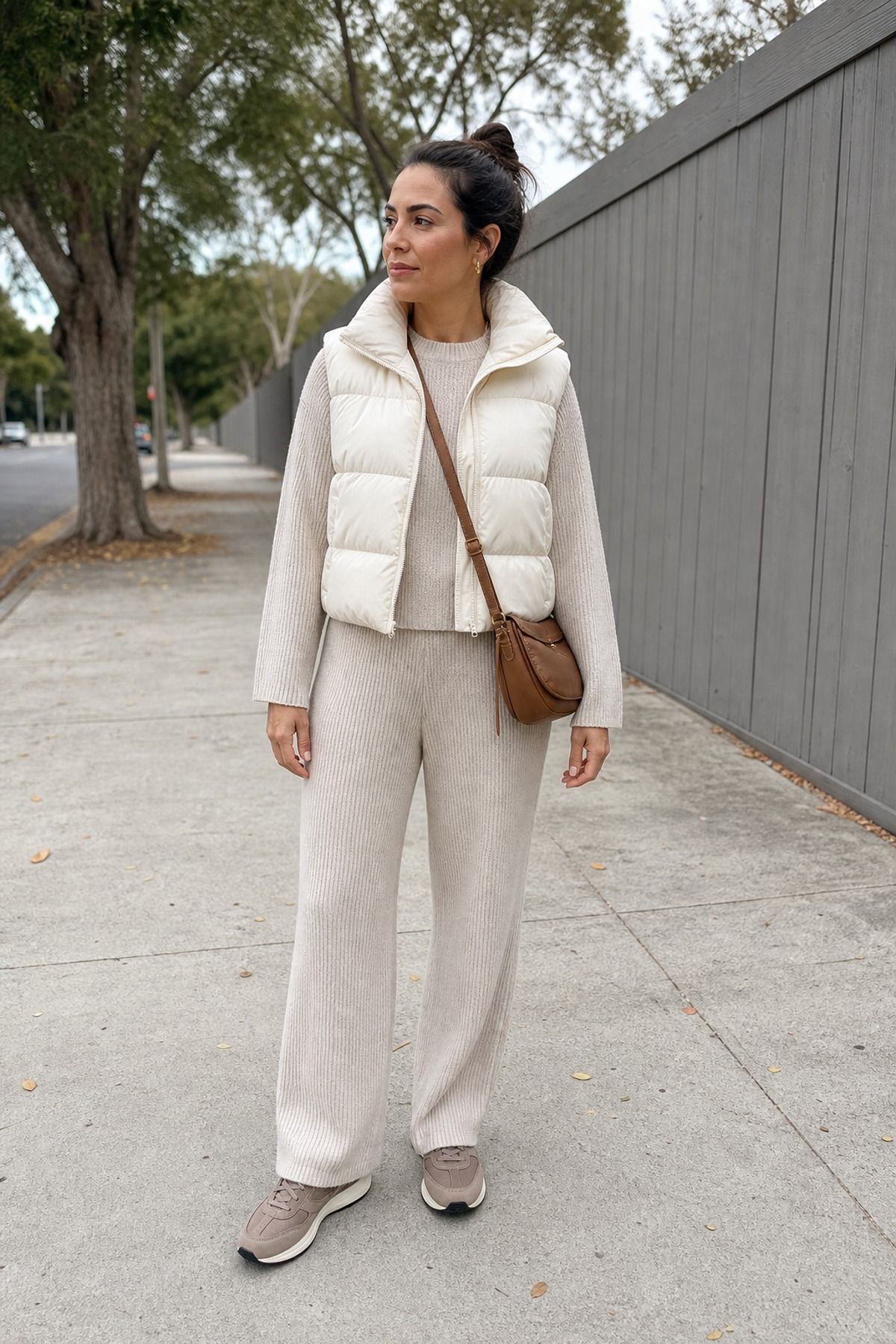 Woman wearing a puffer vest with a knit set, a school drop off outfit