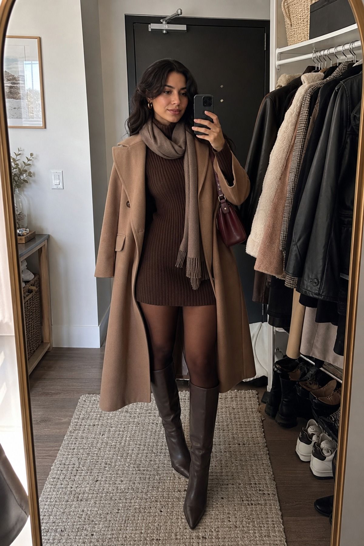 Woman wearing a sweater dress with knee-high boots, a winter dress outfit