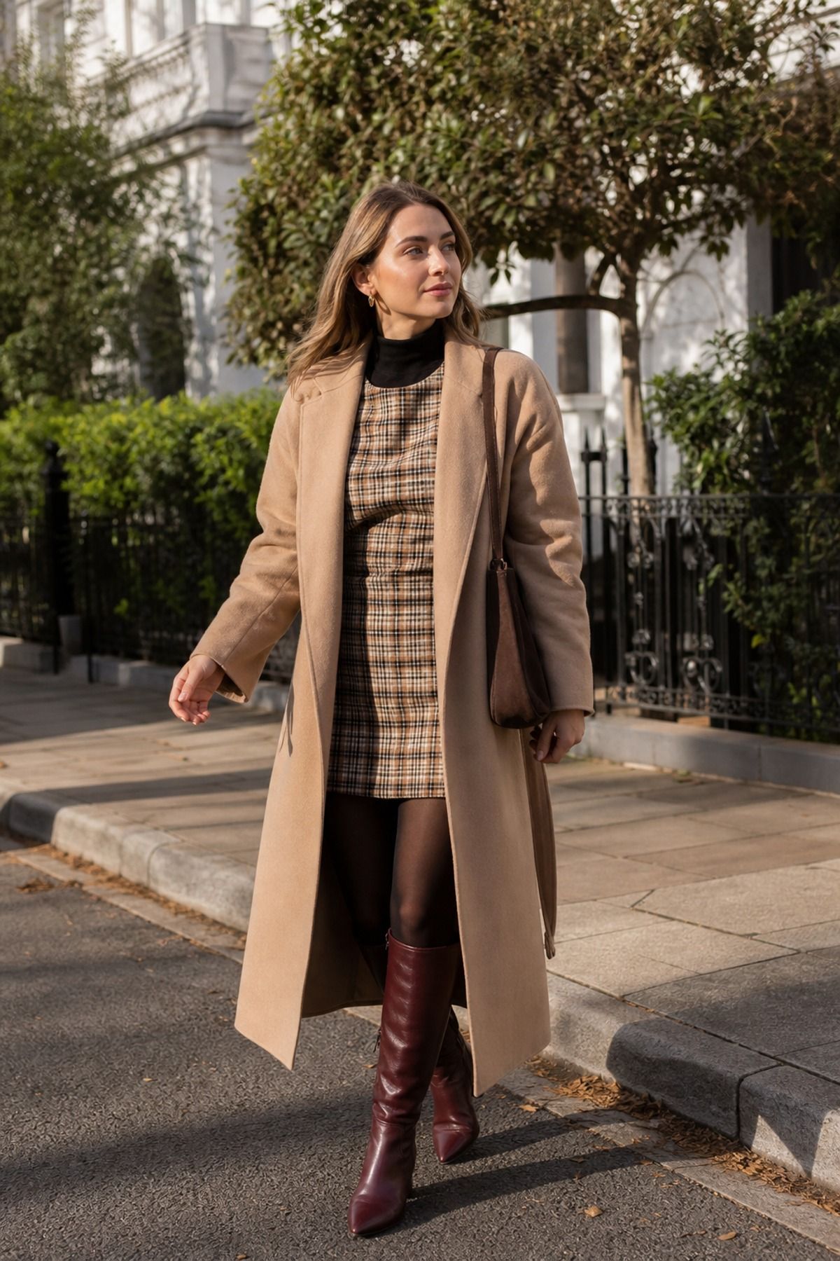 Woman wearing a plaid dress with tall boots, a winter dress outfit