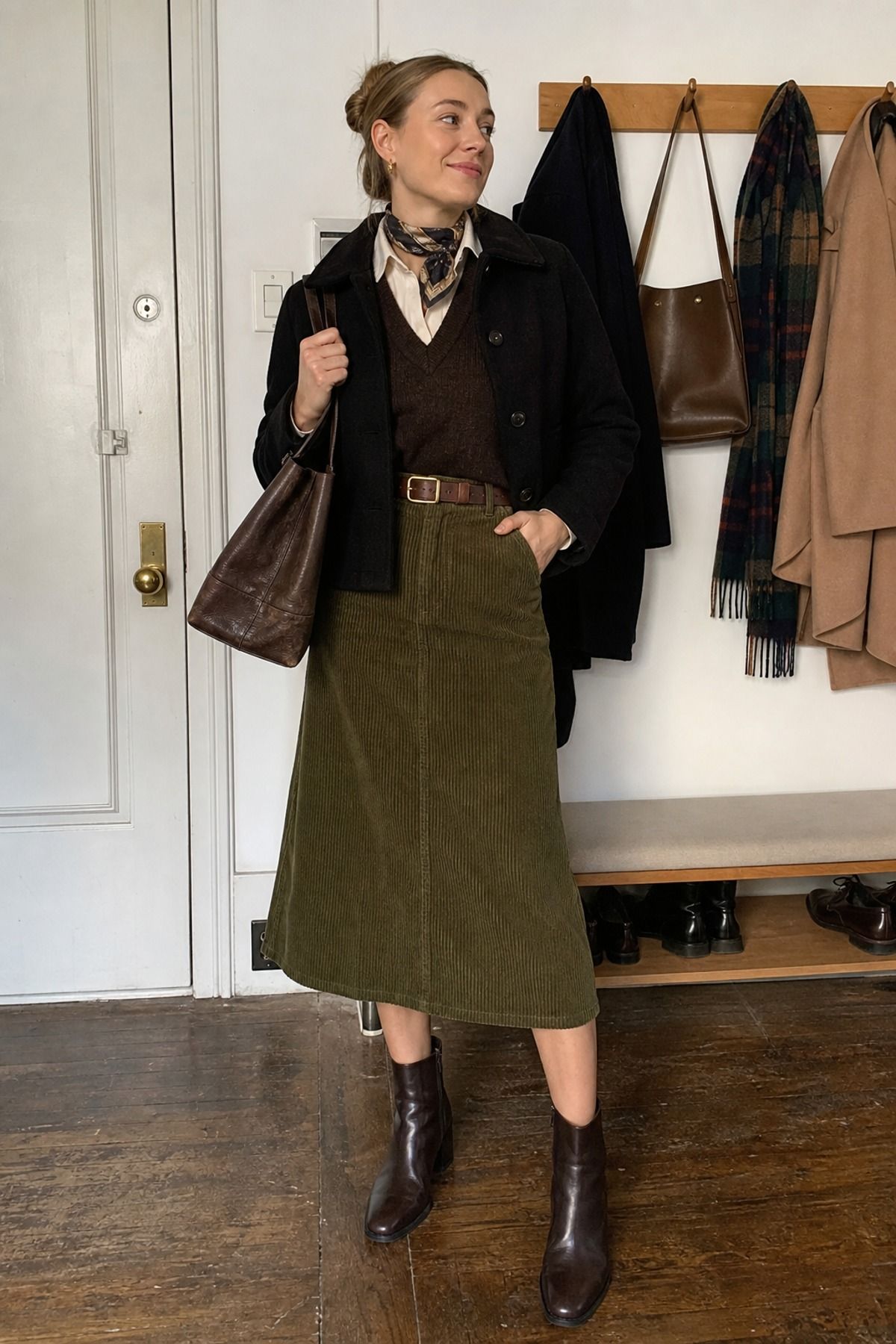 Woman wearing a corduroy skirt with a button down, a winter skirt outfit
