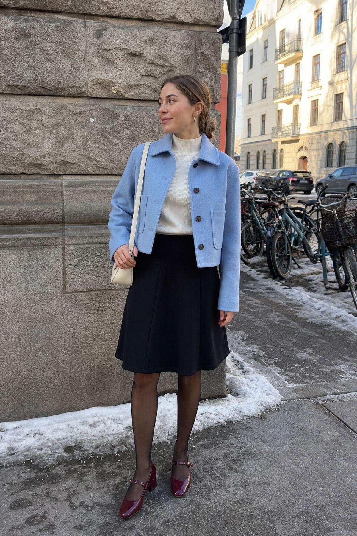 Woman wearing an a-line skirt with a cropped jacket, a winter skirt outfit
