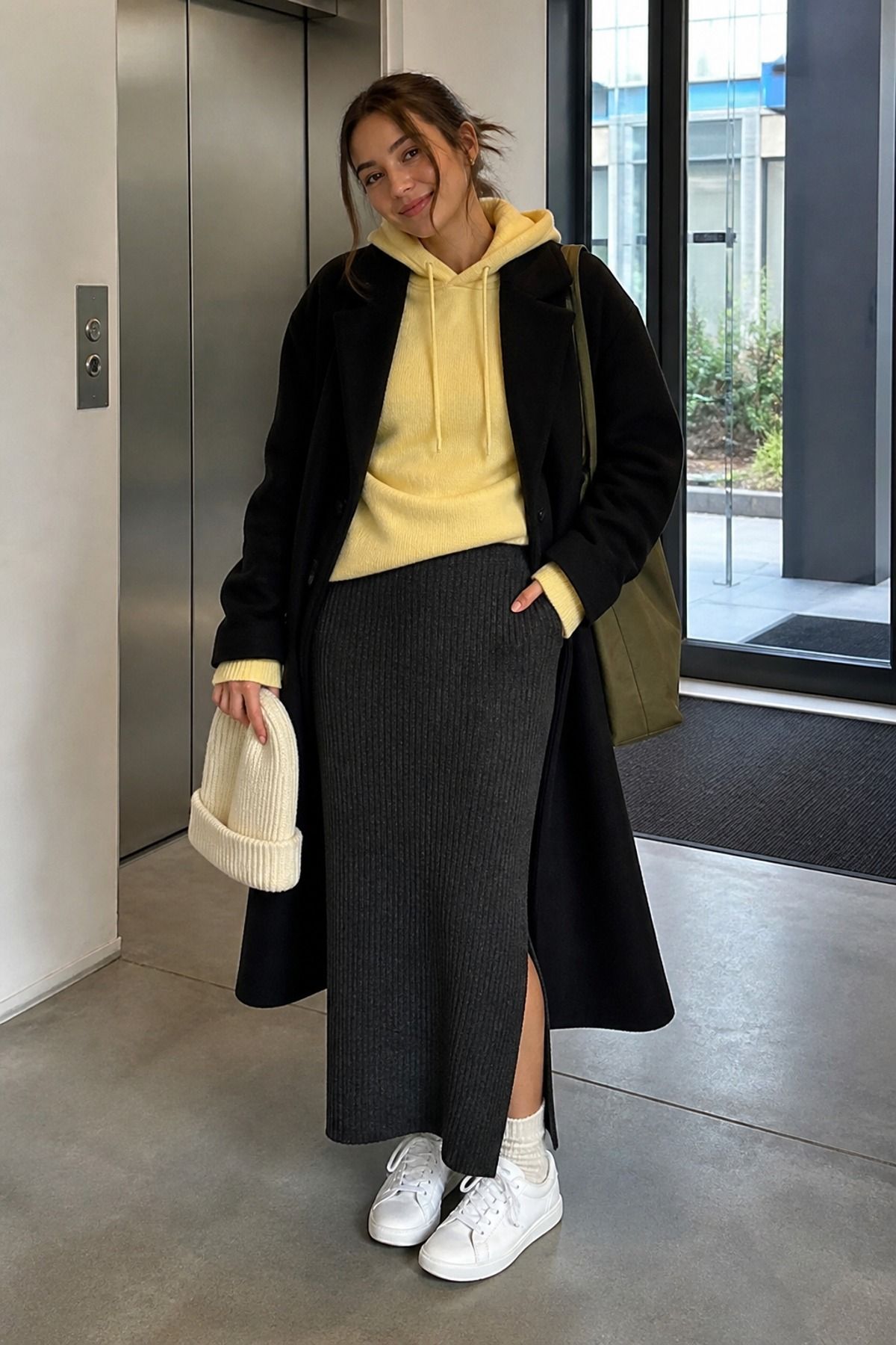 Woman wearing a column skirt with a cashmere hoodie, a winter skirt outfit