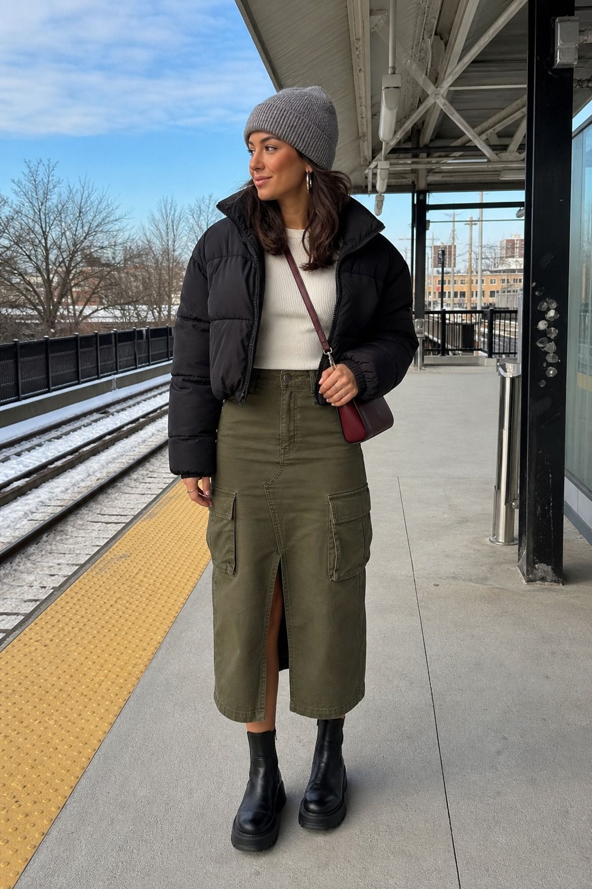 Woman wearing a cargo skirt with a puffer jacket, a winter skirt outfit