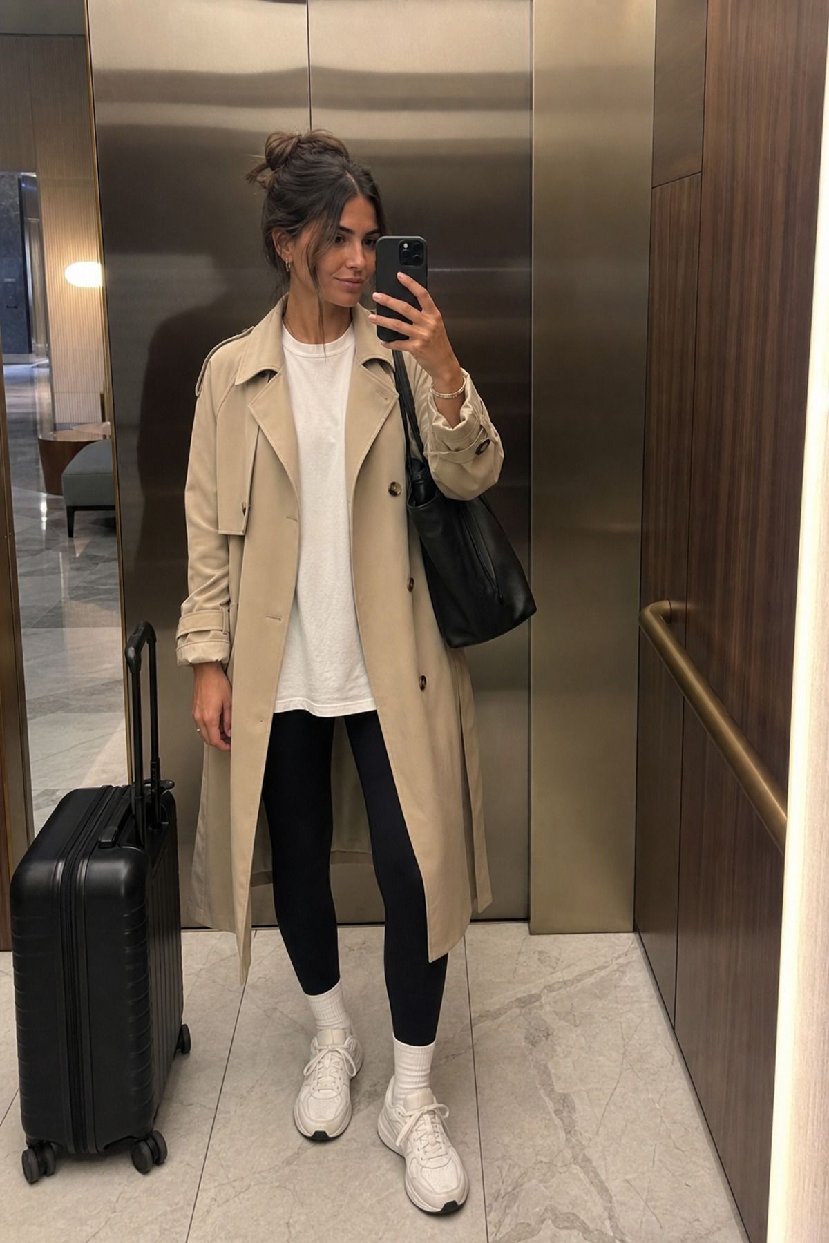 Woman wearing leggings with a trench airport