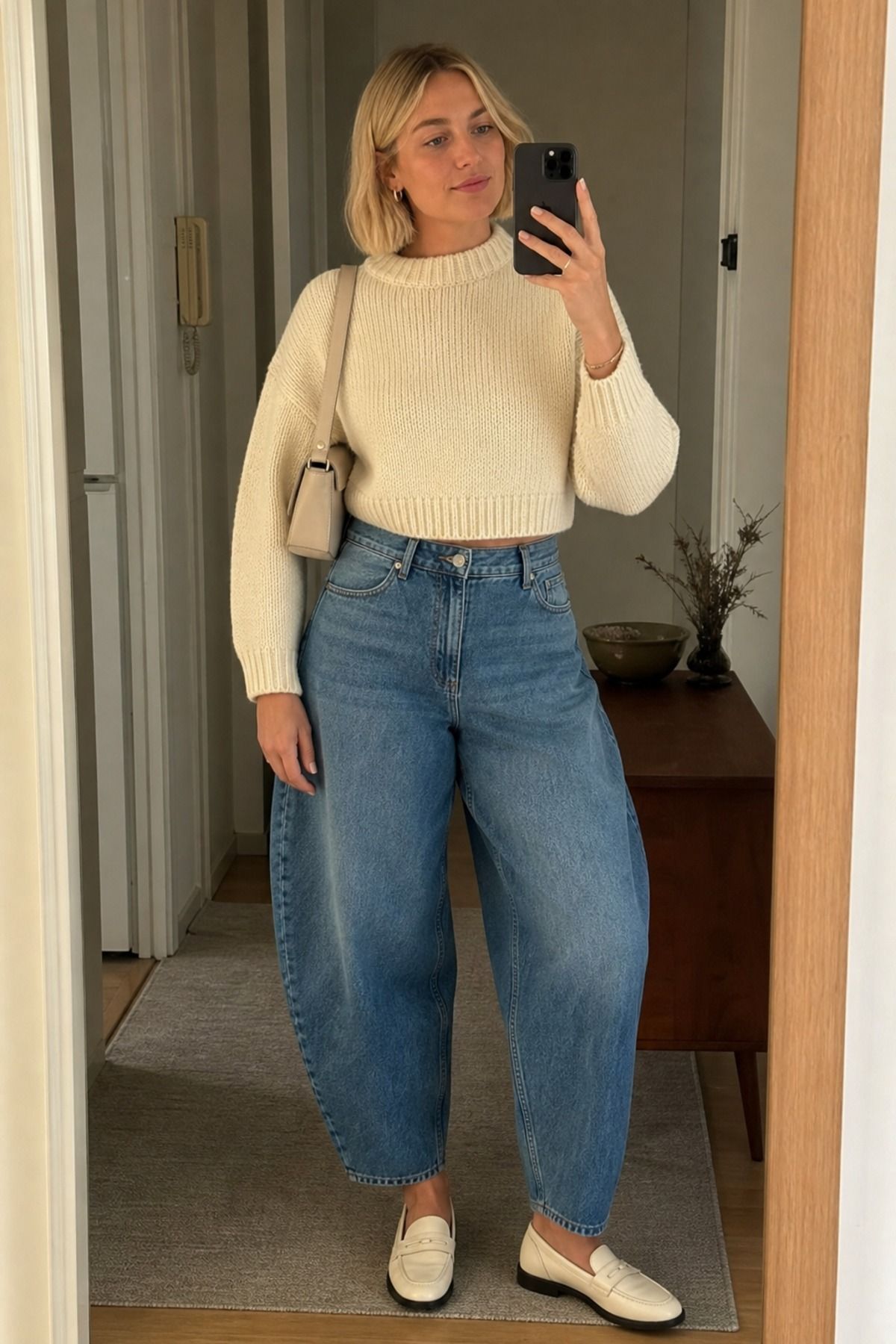 Woman wearing barrel jeans with a cropped knit