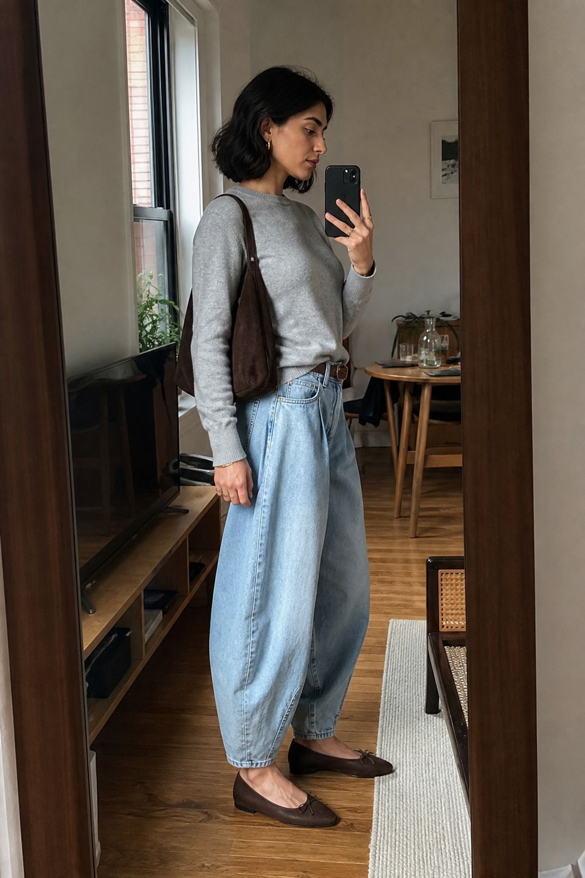 Woman wearing barrel jeans with a fine gauge sweater