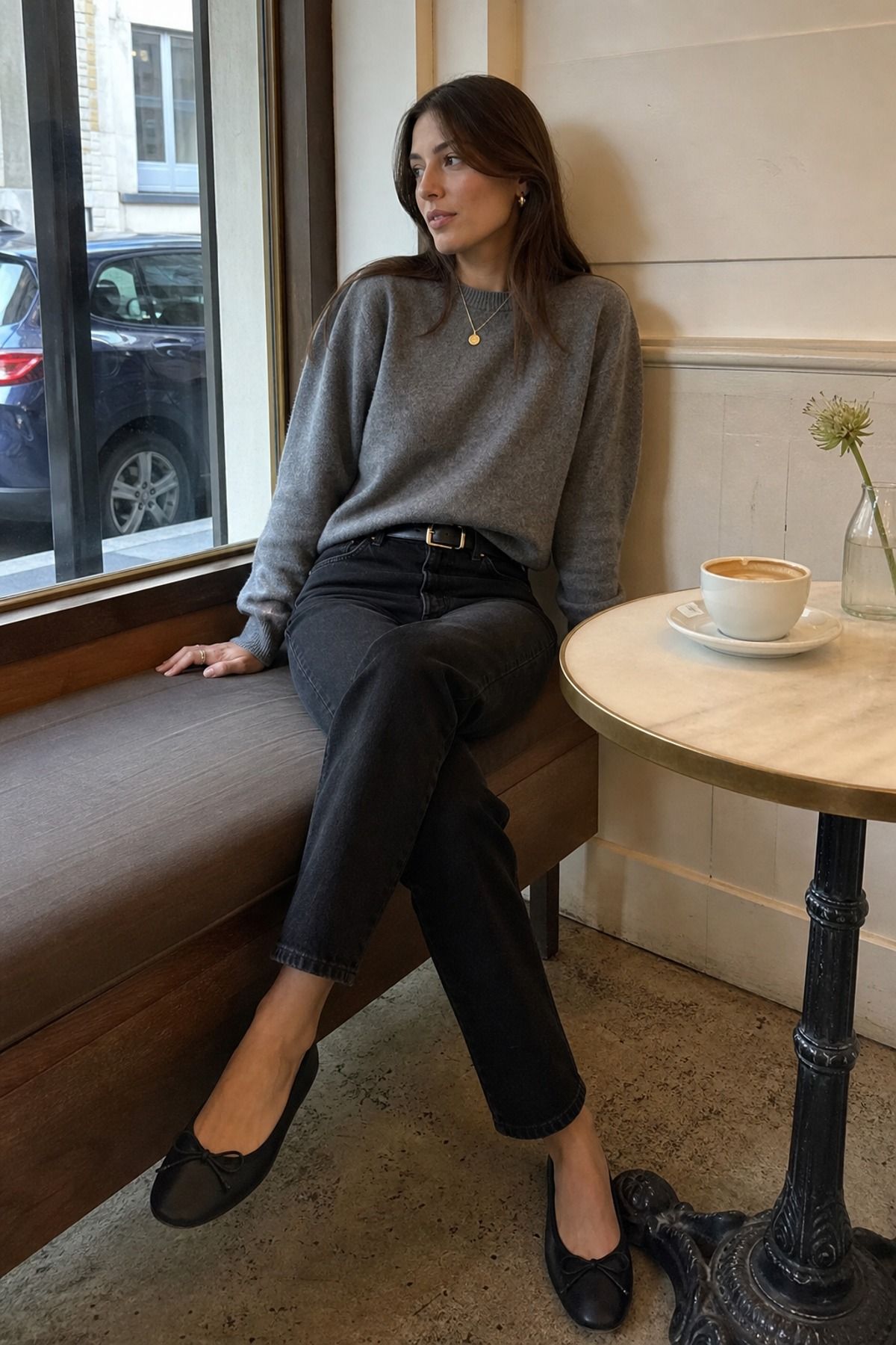 Woman wearing black jeans with a grey cashmere sweater