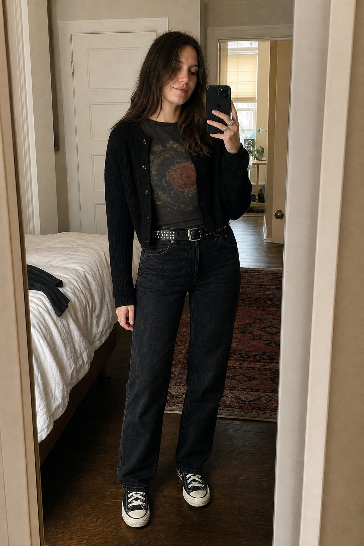Woman wearing black jeans with a graphic tee