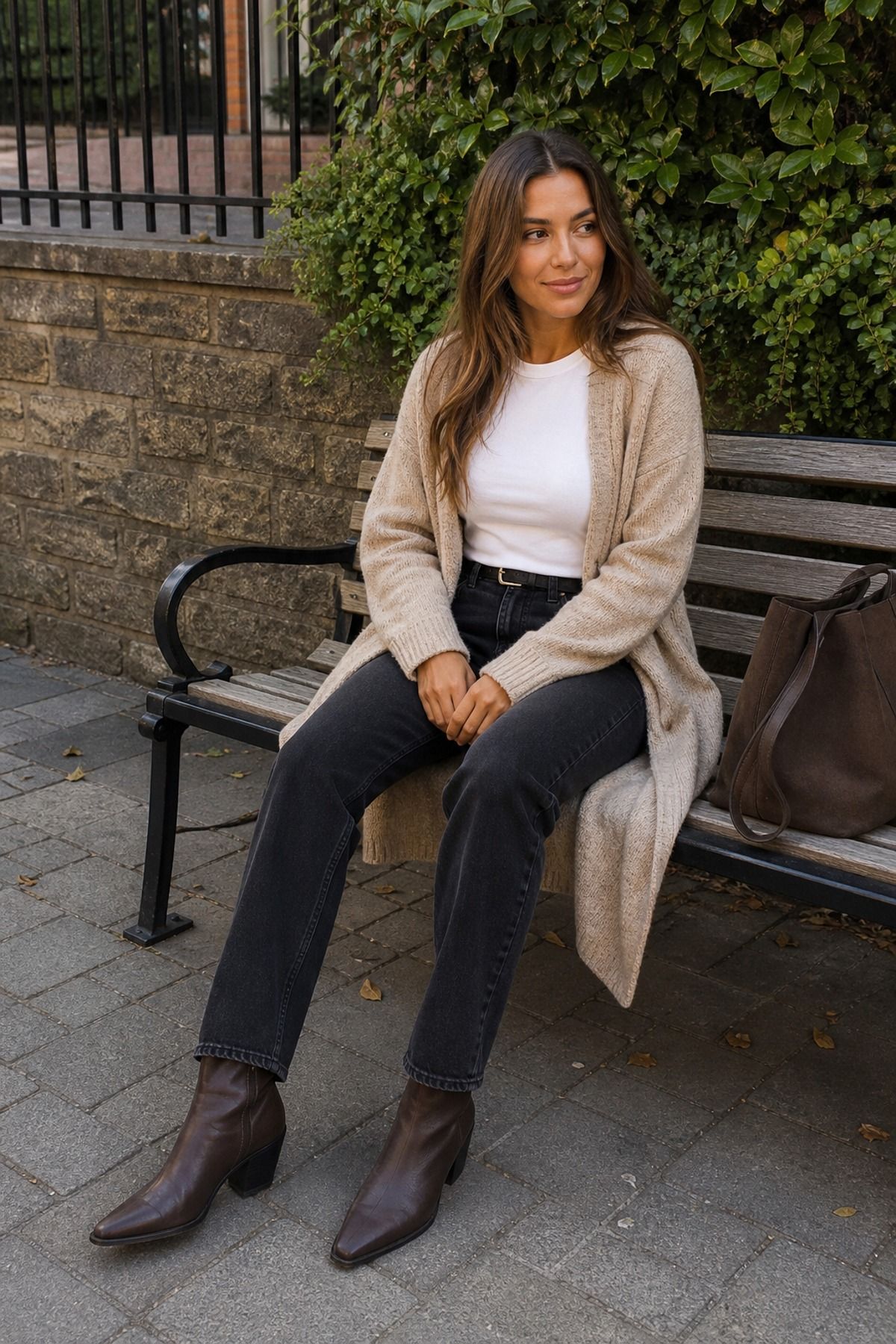 Woman wearing black jeans with a long cardigan