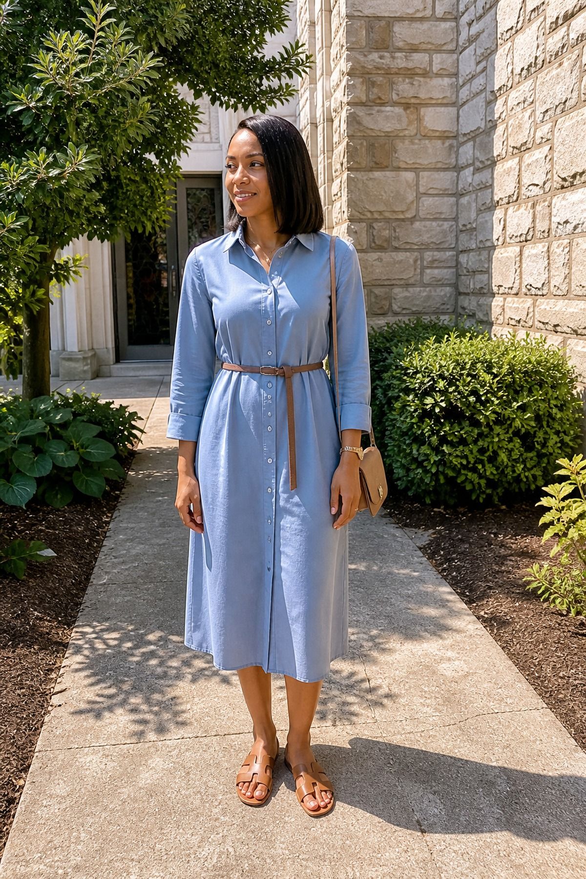 Woman wearing a shirt dress with a slim belt, a casual church outfit