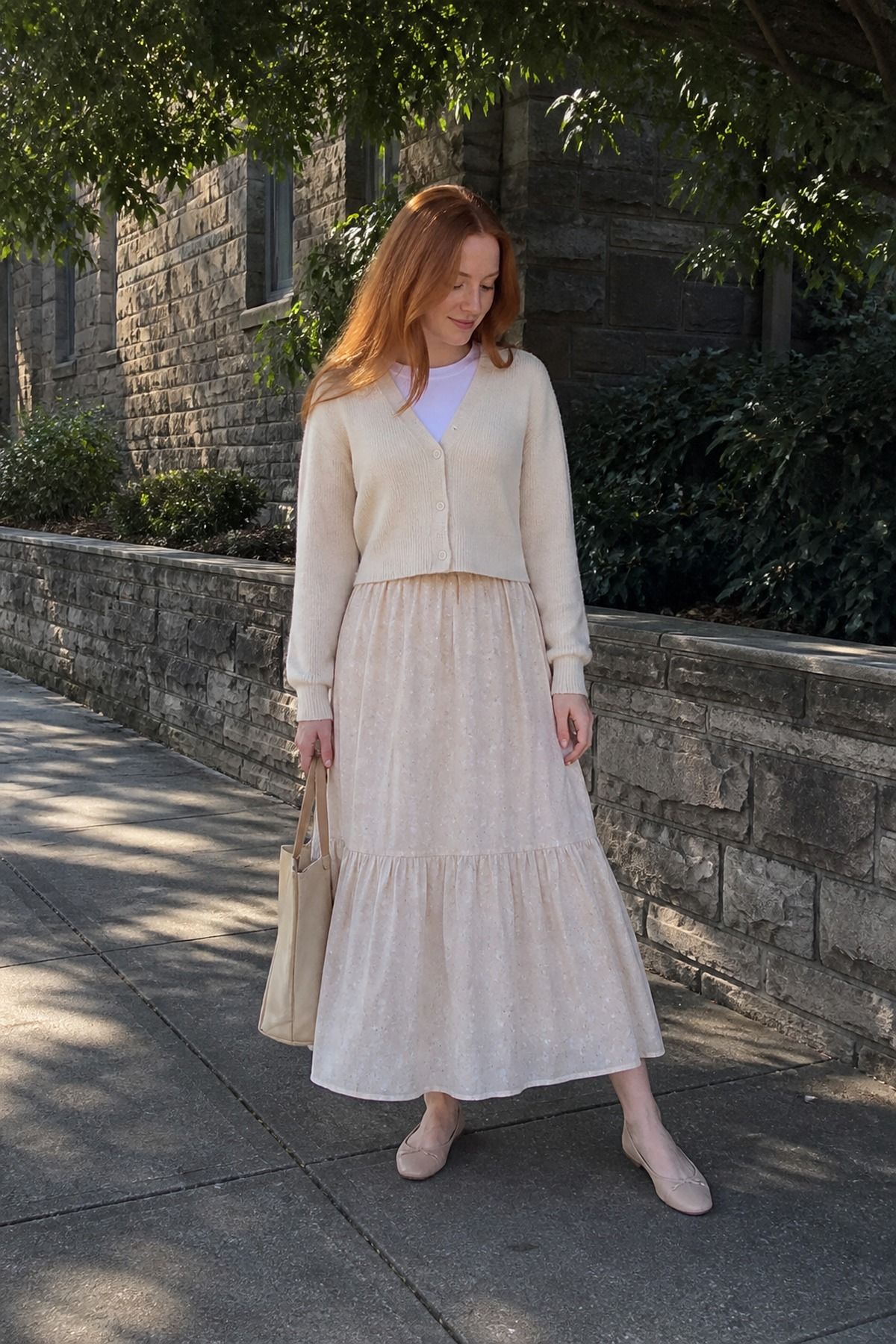 Woman wearing a maxi skirt with a cropped cardigan, a casual church outfit