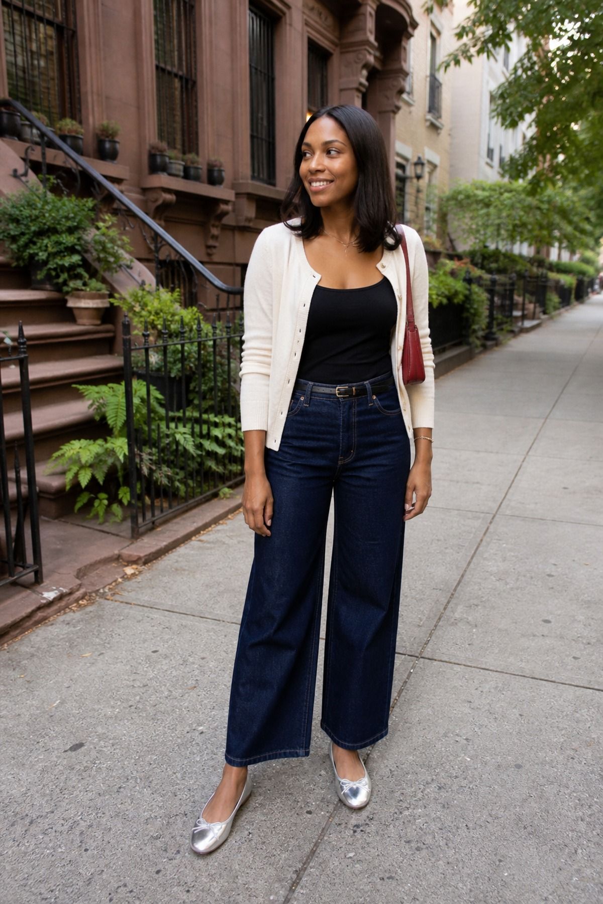 Woman wearing metallic flats with wide-leg jeans, a casual party outfit